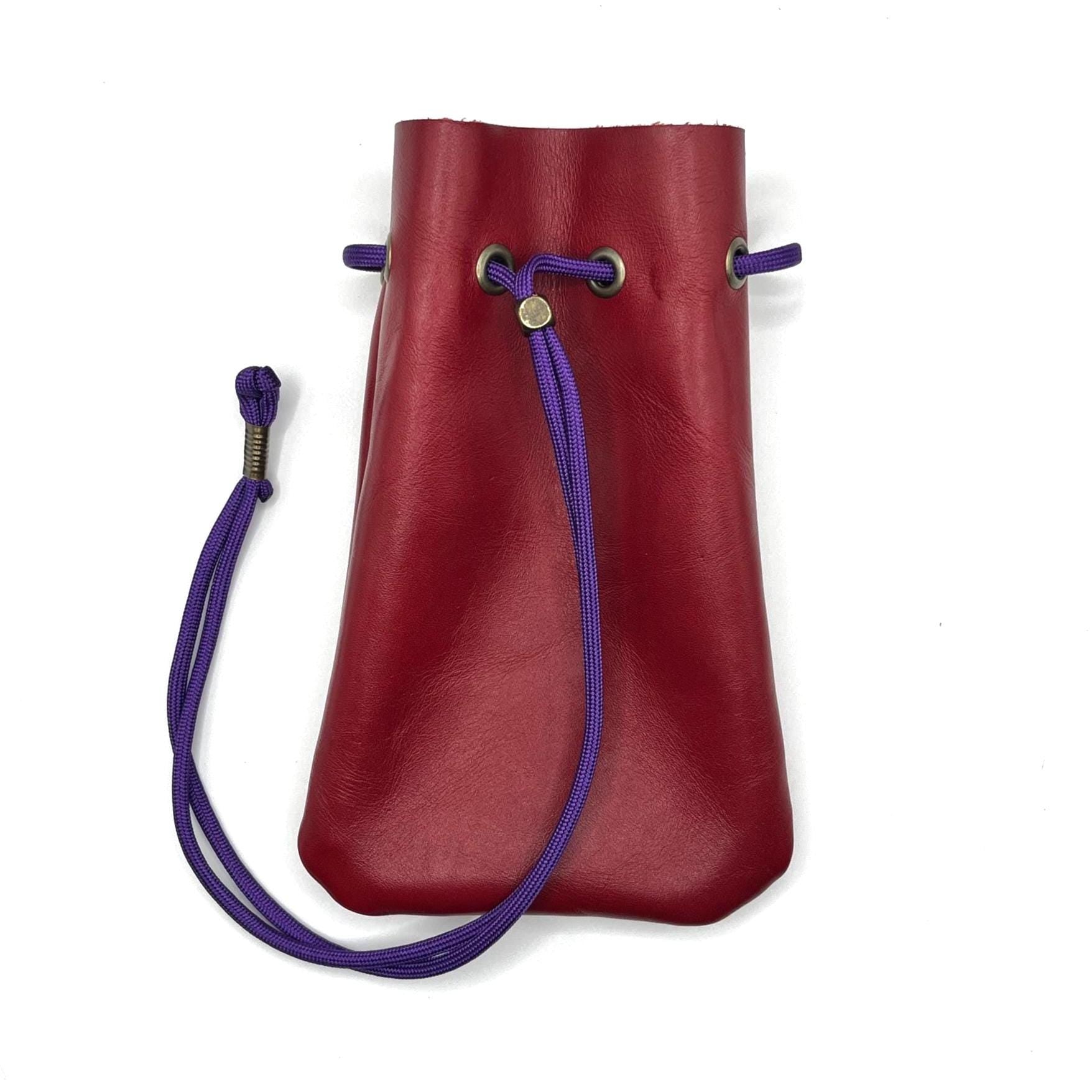 Handcrafted leather dice bag with drawstring, ideal for storing RPG dice sets. Perfect for DnD, tabletop games, or as a fantasy gift for gamers.