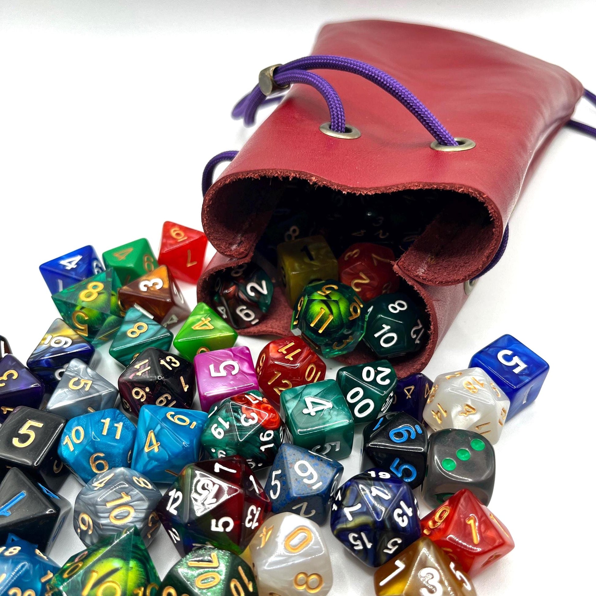 Handcrafted leather dice bag with drawstring, ideal for storing RPG dice sets. Perfect for DnD, tabletop games, or as a fantasy gift for gamers.
