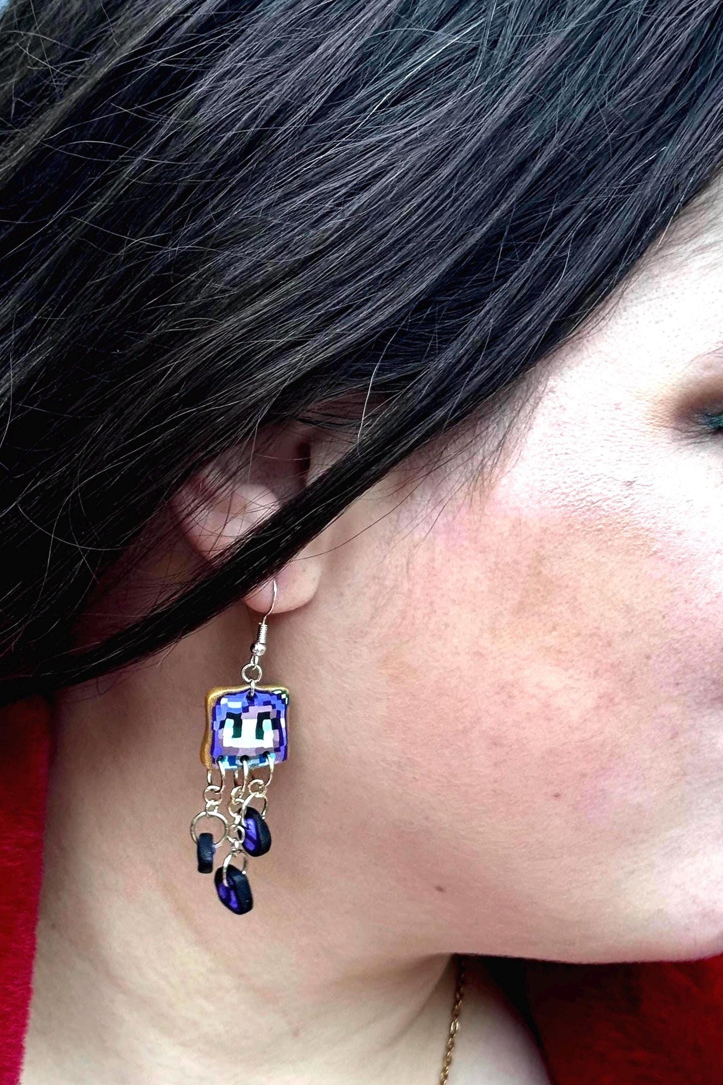 Handmade dangle earrings inspired by Abigail’s love of amethysts in Stardew Valley. Perfect gamer girl gift, cosplay jewelry, or crystal fan accessory.