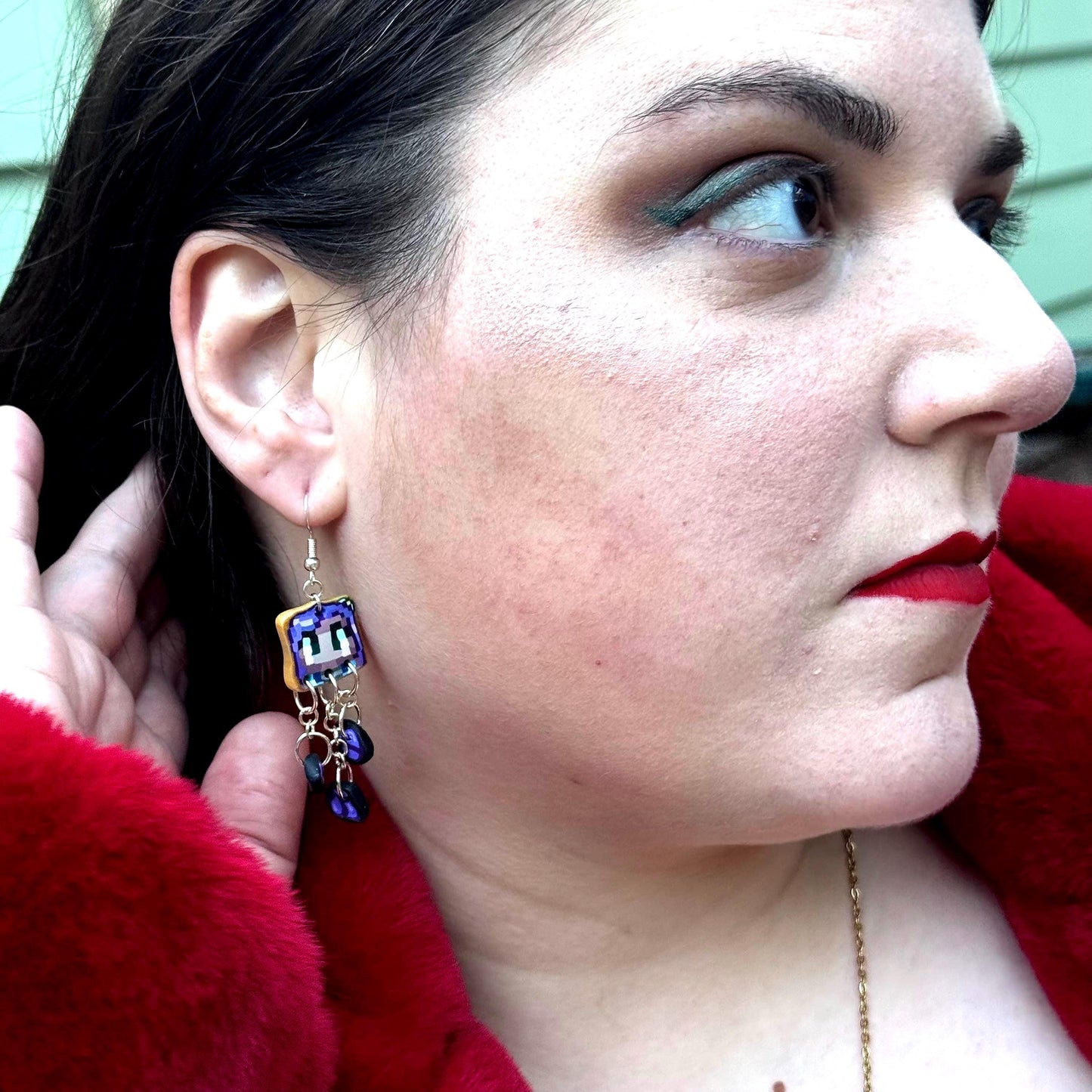 Handmade dangle earrings inspired by Abigail’s love of amethysts in Stardew Valley. Perfect gamer girl gift, cosplay jewelry, or crystal fan accessory.