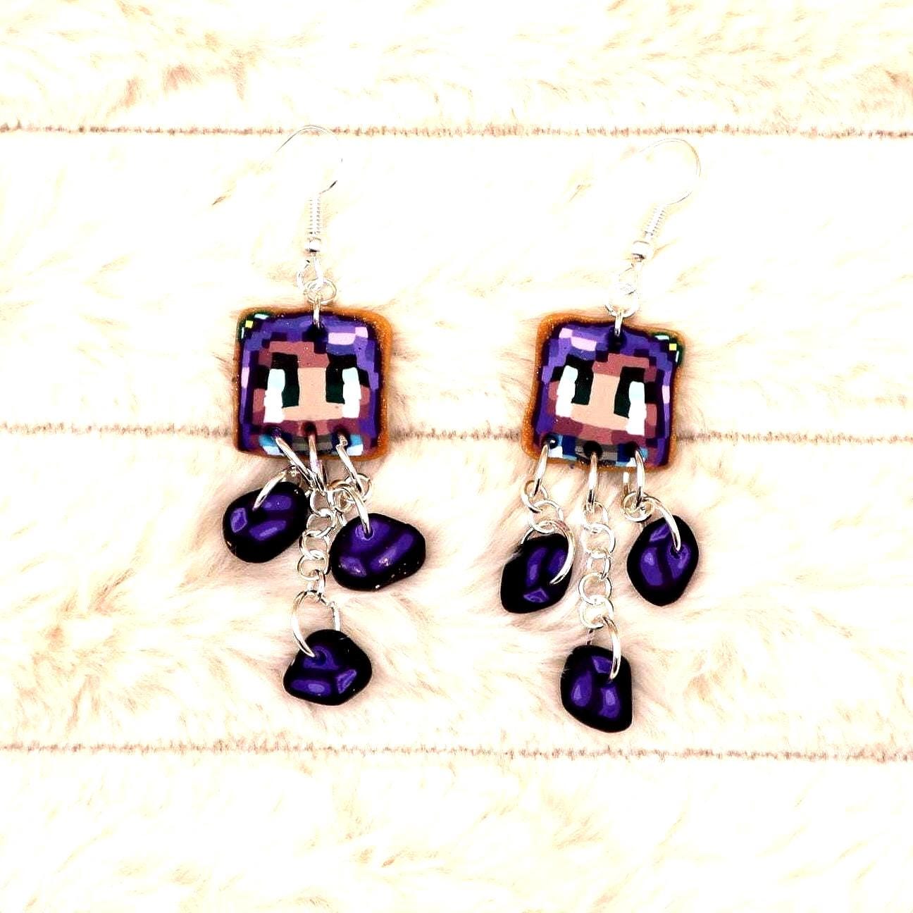 Handmade dangle earrings inspired by Abigail’s love of amethysts in Stardew Valley. Perfect gamer girl gift, cosplay jewelry, or crystal fan accessory.