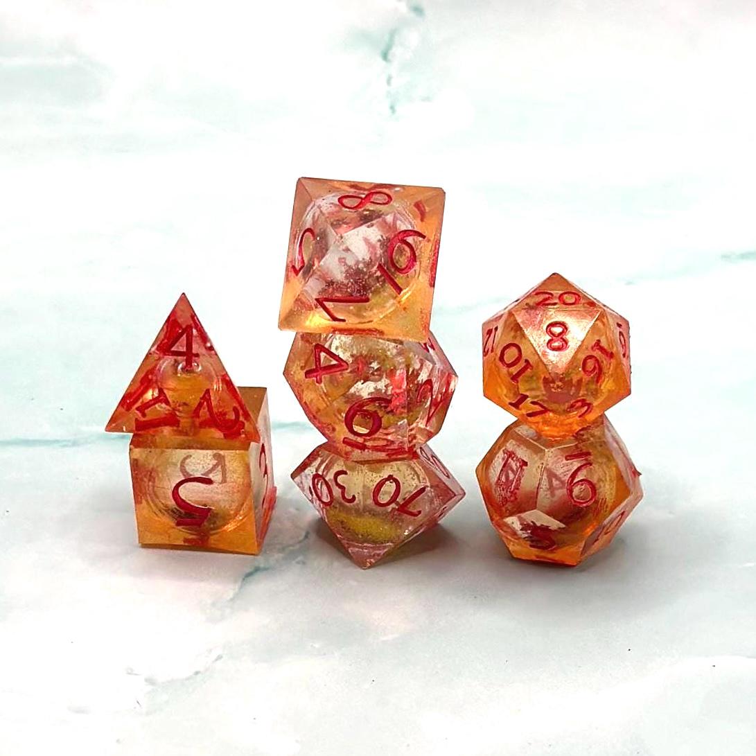 Orange Fall Foliage Liquid Core Dice Set – sharp edge polyhedral DnD dice featuring swirling autumn leaves and shimmering orange liquid core. Perfect for tabletop RPGs, Dungeons & Dragons, or dice collectors. Handmade resin dice with crisp numbers, glowing fall colors, and mesmerizing motion that captures the beauty of autumn. Ideal DnD gift or gaming accessory for players who love seasonal fantasy aesthetics.