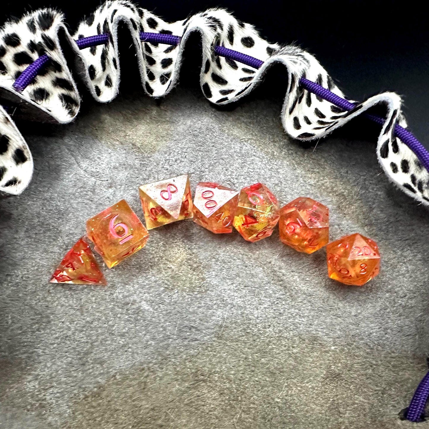 Orange Fall Foliage Liquid Core Dice Set – sharp edge polyhedral DnD dice featuring swirling autumn leaves and shimmering orange liquid core. Perfect for tabletop RPGs, Dungeons & Dragons, or dice collectors. Handmade resin dice with crisp numbers, glowing fall colors, and mesmerizing motion that captures the beauty of autumn. Ideal DnD gift or gaming accessory for players who love seasonal fantasy aesthetics.