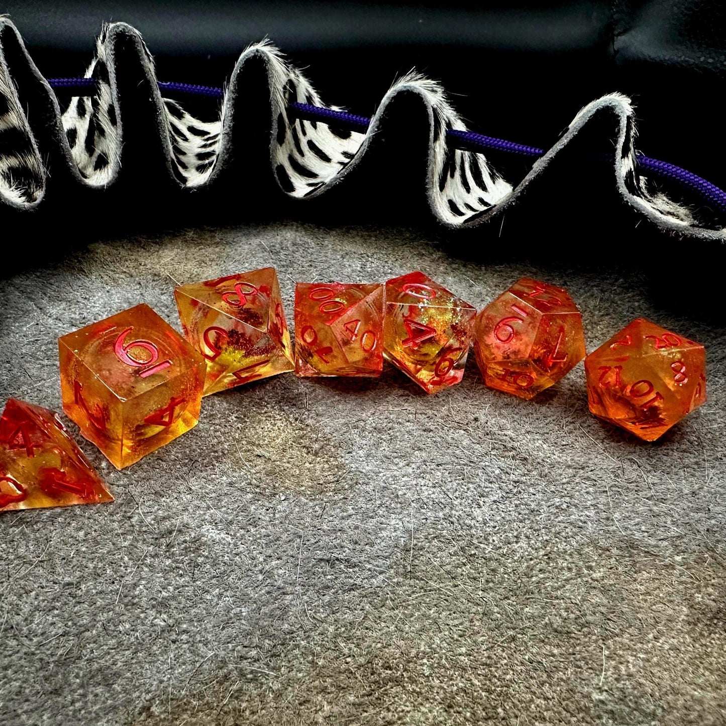 Orange Fall Foliage Liquid Core Dice Set – sharp edge polyhedral DnD dice featuring swirling autumn leaves and shimmering orange liquid core. Perfect for tabletop RPGs, Dungeons & Dragons, or dice collectors. Handmade resin dice with crisp numbers, glowing fall colors, and mesmerizing motion that captures the beauty of autumn. Ideal DnD gift or gaming accessory for players who love seasonal fantasy aesthetics.