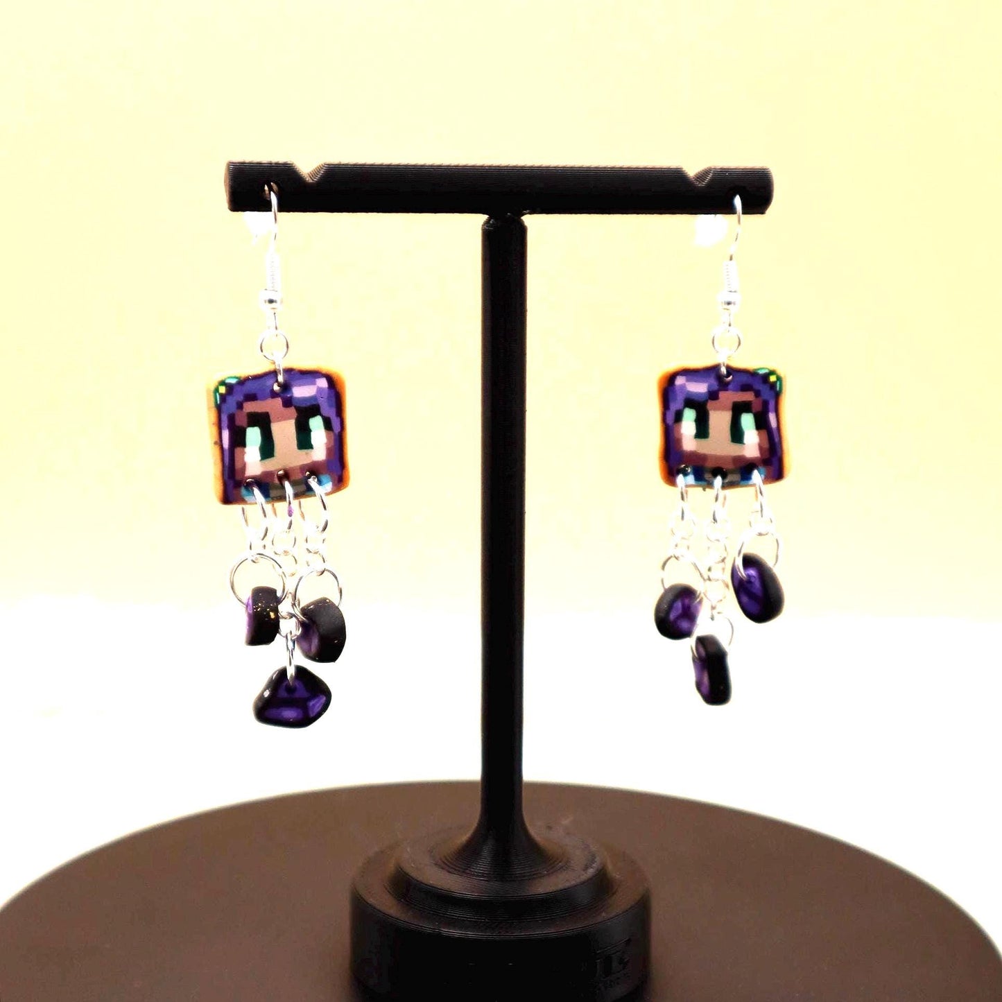 Handmade dangle earrings inspired by Abigail’s love of amethysts in Stardew Valley. Perfect gamer girl gift, cosplay jewelry, or crystal fan accessory.