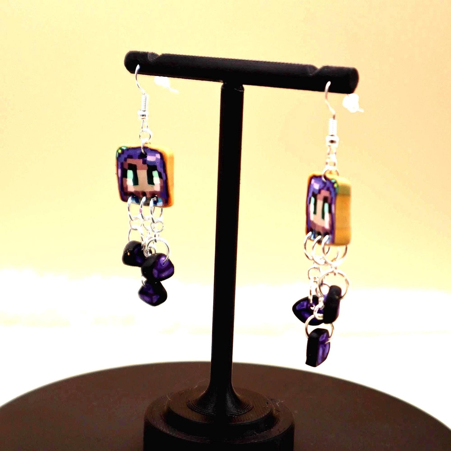 Handmade dangle earrings inspired by Abigail’s love of amethysts in Stardew Valley. Perfect gamer girl gift, cosplay jewelry, or crystal fan accessory.