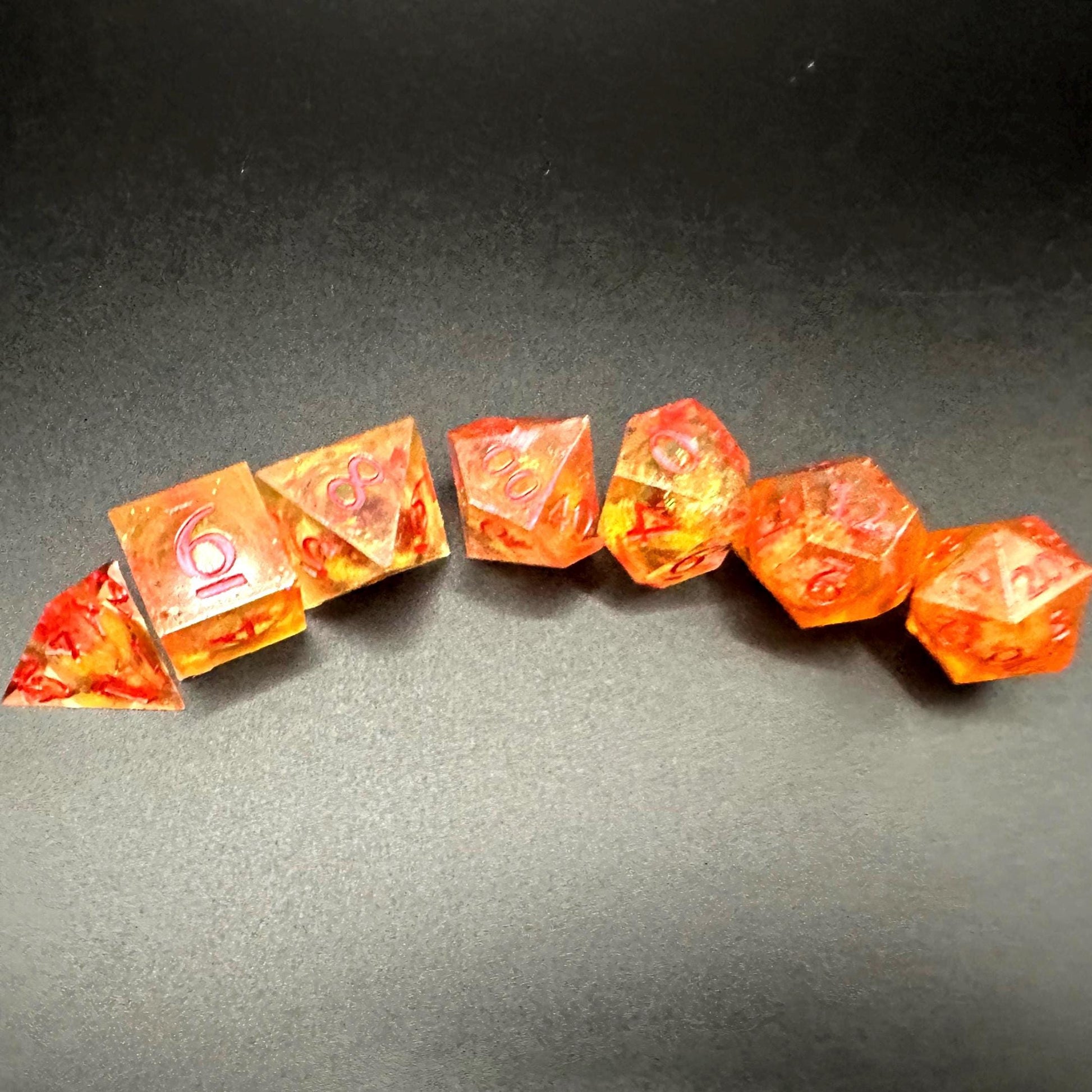 Orange Fall Foliage Liquid Core Dice Set – sharp edge polyhedral DnD dice featuring swirling autumn leaves and shimmering orange liquid core. Perfect for tabletop RPGs, Dungeons & Dragons, or dice collectors. Handmade resin dice with crisp numbers, glowing fall colors, and mesmerizing motion that captures the beauty of autumn. Ideal DnD gift or gaming accessory for players who love seasonal fantasy aesthetics.