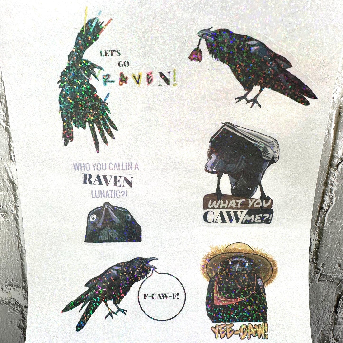 Raven crow pun sticker sheet with funny bird wordplay. Gothic humor vinyl stickers featuring ravens and crows, perfect for laptops, journals, water bottles, and gifts.