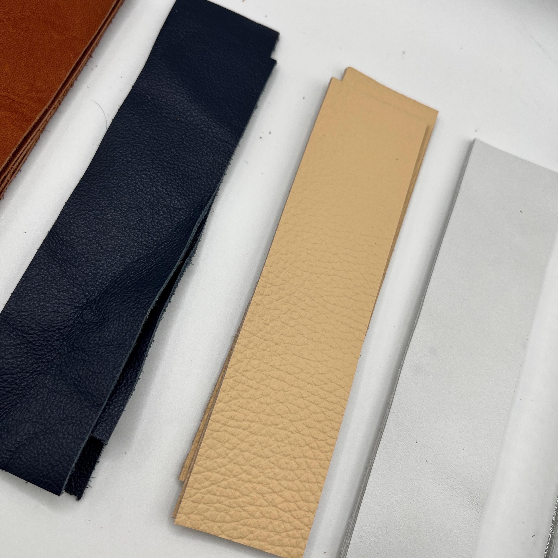 Handmade upcycled Italian leather bookmark cut from upholstery-grade leather scraps, slim durable page marker with natural grain, sustainable gift for readers and book lovers