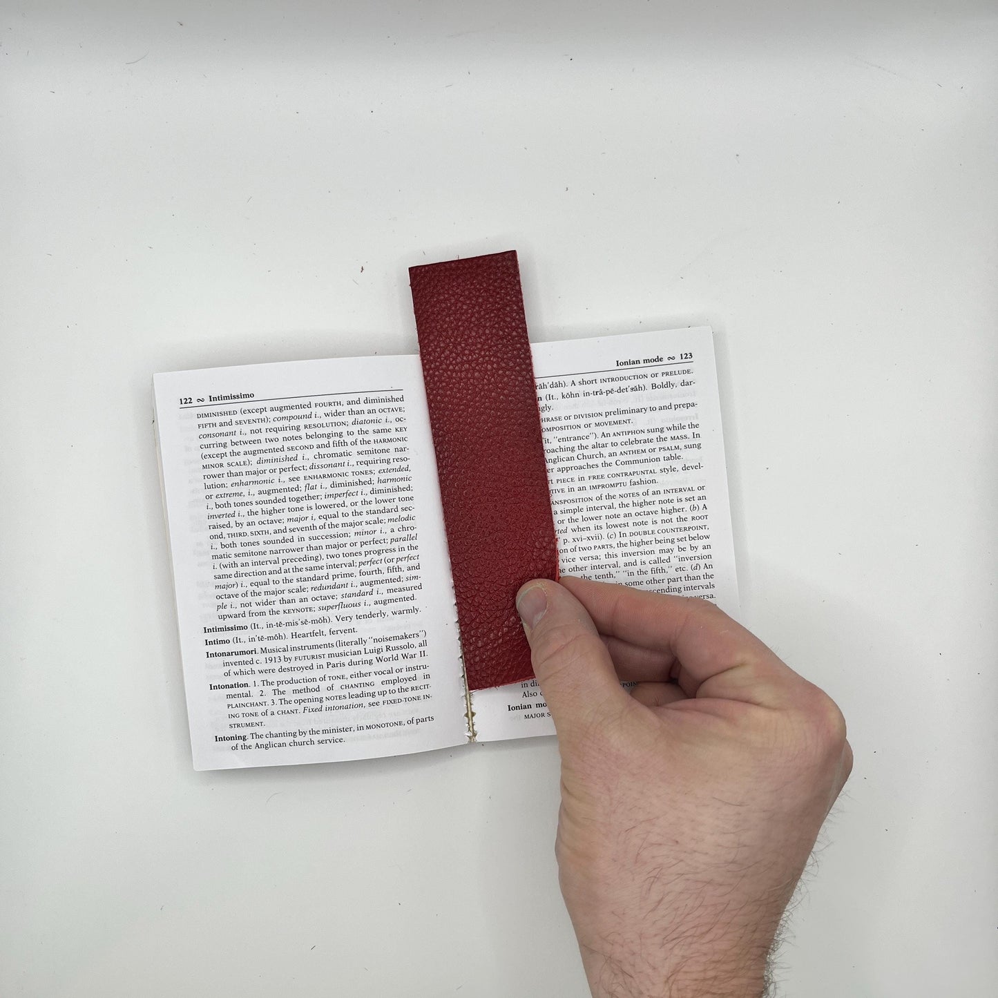 Handmade upcycled Italian leather bookmark cut from upholstery-grade leather scraps, slim durable page marker with natural grain, sustainable gift for readers and book lovers