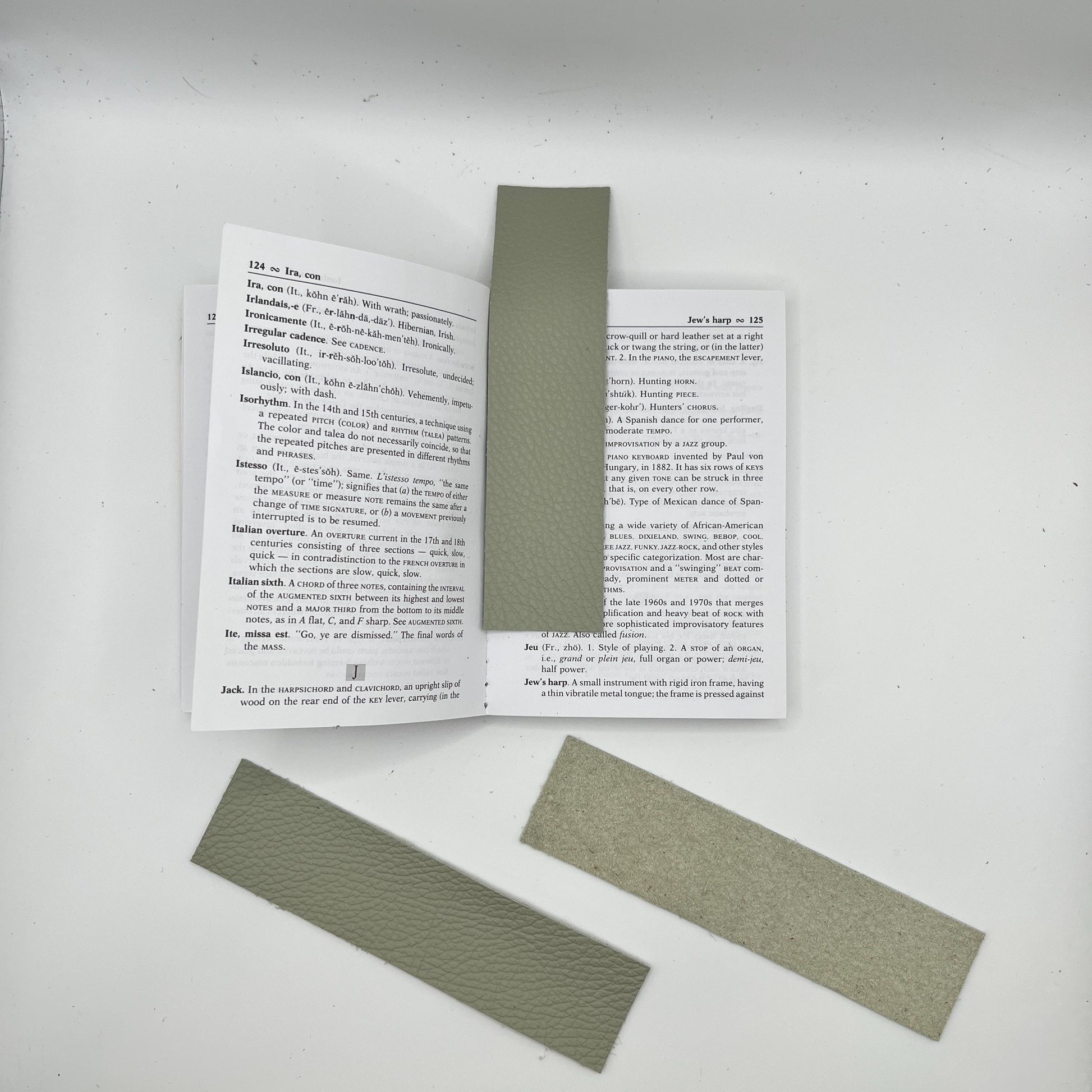 Handmade upcycled Italian green leather bookmark cut from upholstery-grade leather scraps, slim durable page marker with natural grain, sustainable gift for readers and book lovers