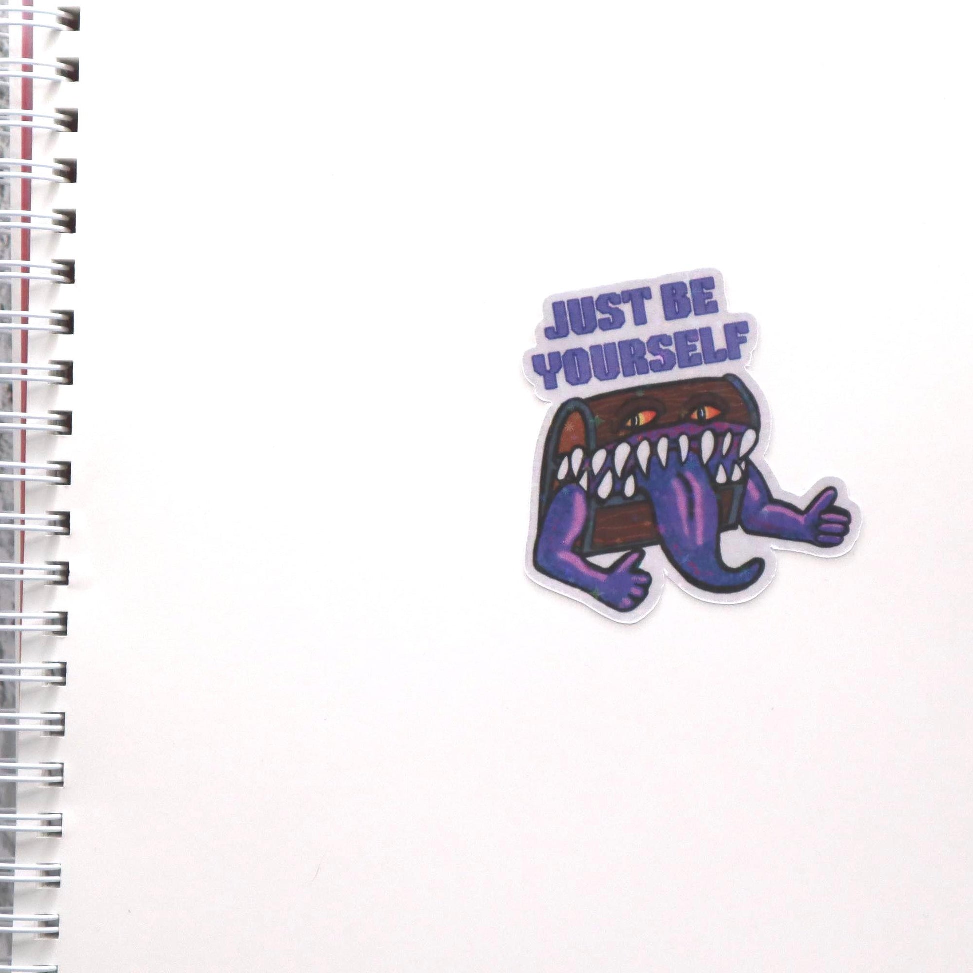 Holographic DnD mimic sticker with a grinning treasure chest and the phrase Just Be Yourself, perfect for laptops, water bottles, and tabletop RPG fans.