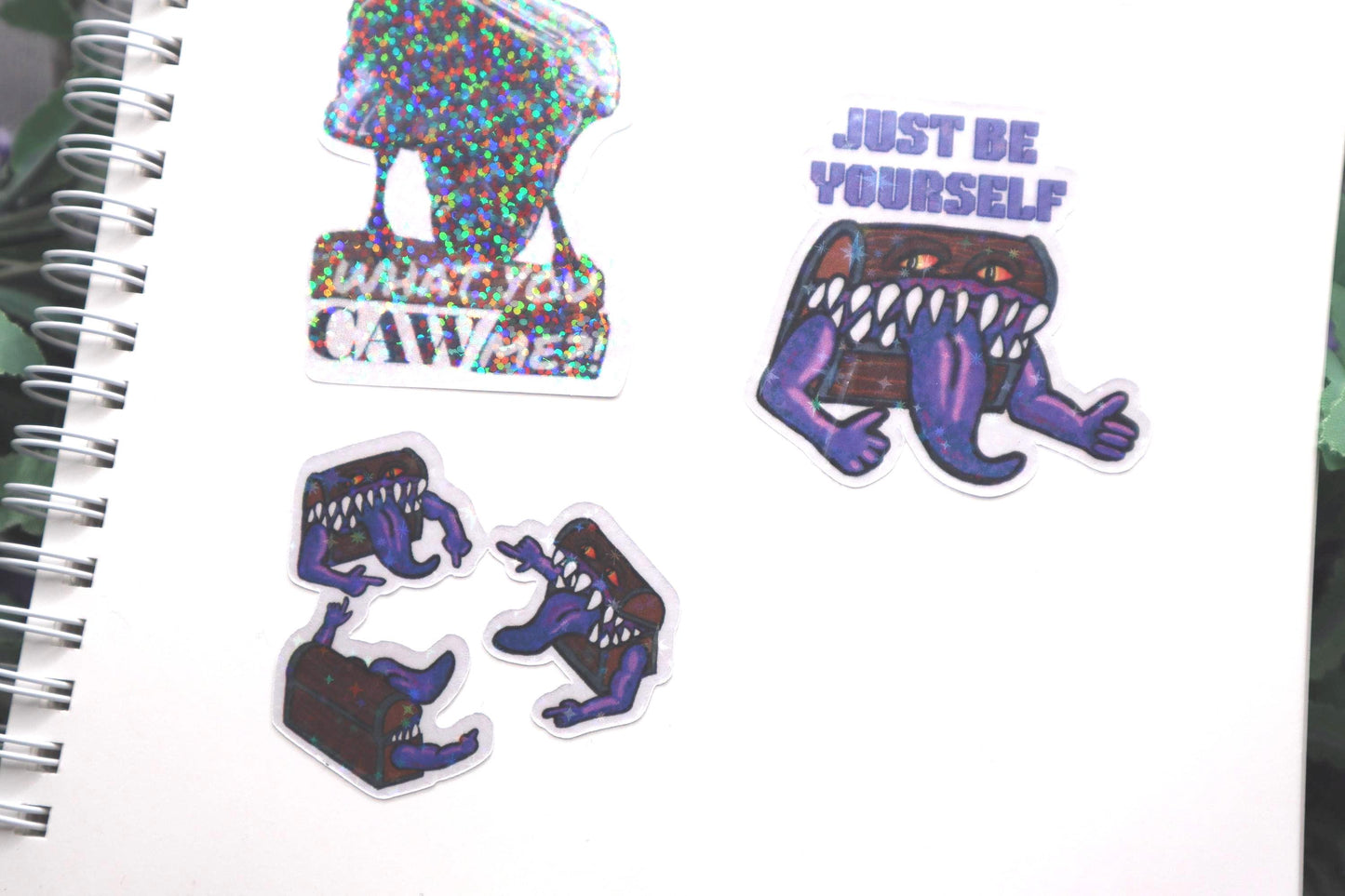 Holographic DnD mimic sticker with a grinning treasure chest and the phrase Just Be Yourself, perfect for laptops, water bottles, and tabletop RPG fans.