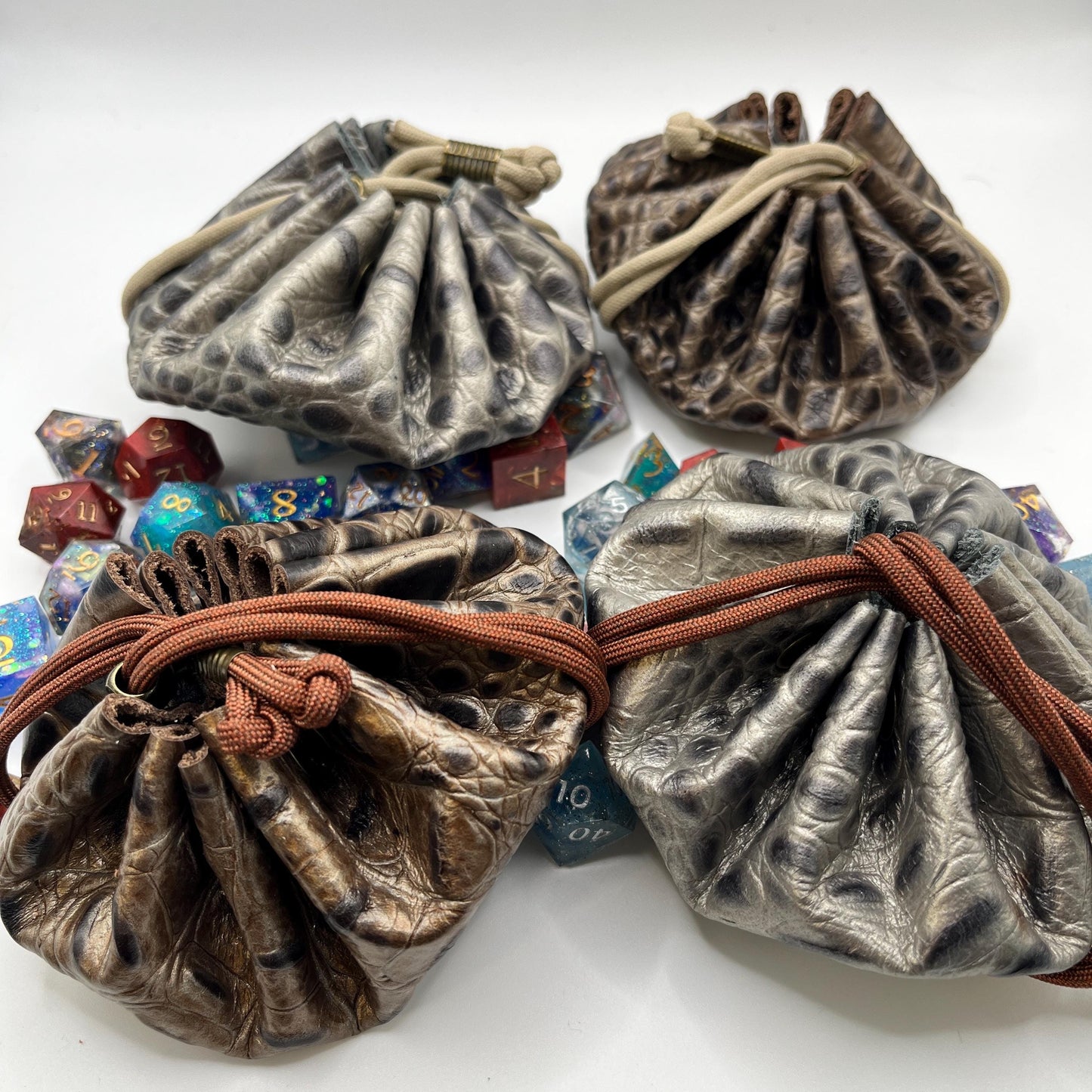 Handcrafted leather dice bag with drawstring, ideal for storing RPG dice sets. Perfect for DnD, tabletop games, or as a fantasy gift for gamers.