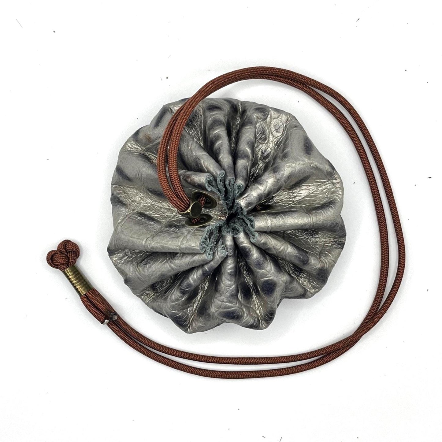 Handcrafted leather dice bag with drawstring, ideal for storing RPG dice sets. Perfect for DnD, tabletop games, or as a fantasy gift for gamers.