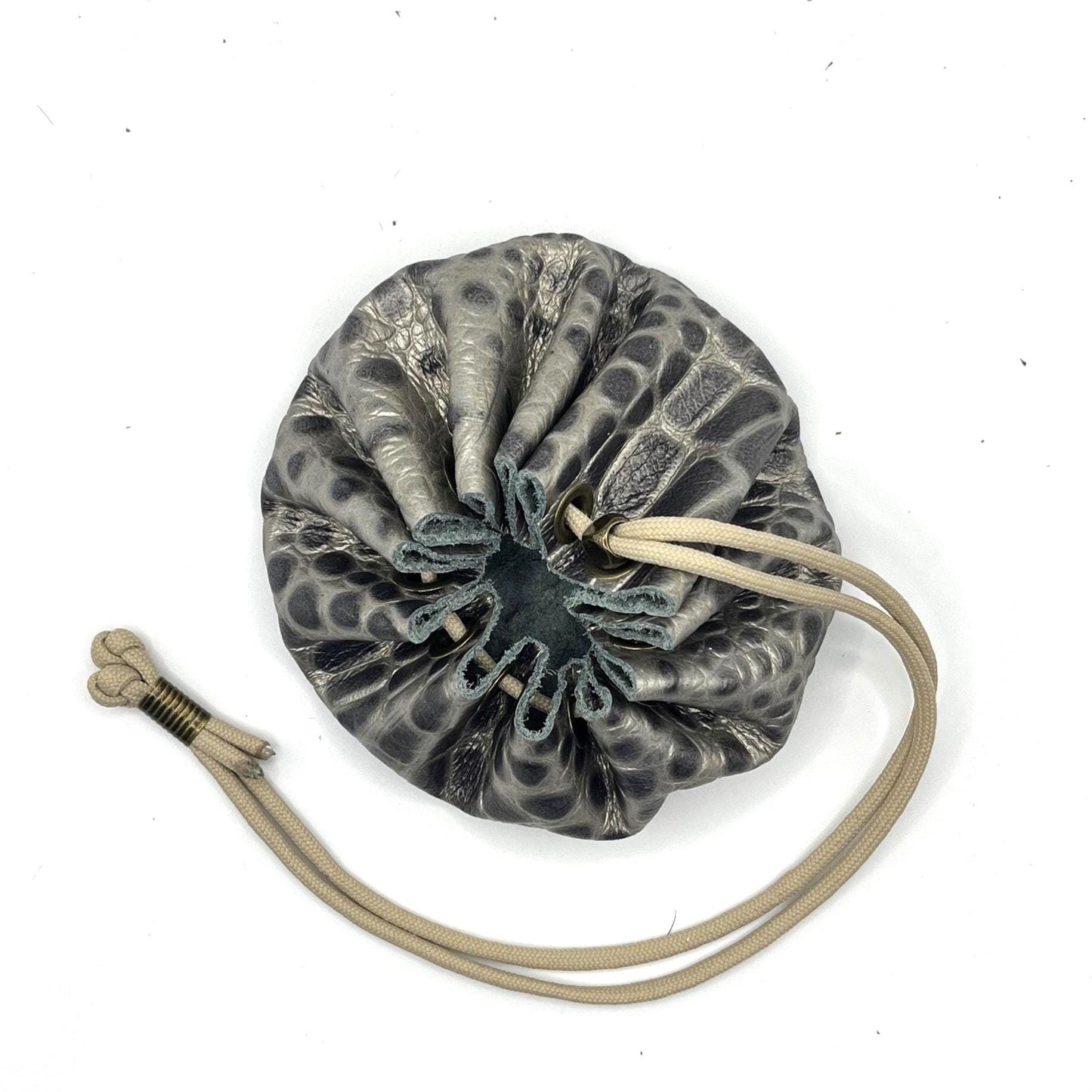 Handcrafted leather dice bag with drawstring, ideal for storing RPG dice sets. Perfect for DnD, tabletop games, or as a fantasy gift for gamers.