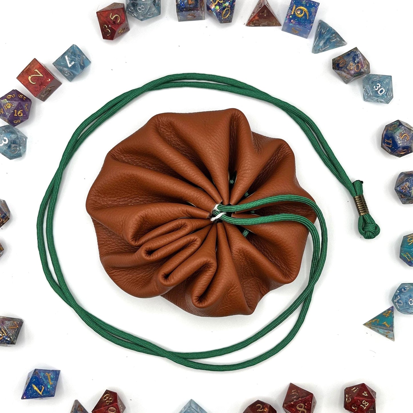 Handcrafted leather dice bag with drawstring, ideal for storing RPG dice sets. Perfect for DnD, tabletop games, or as a fantasy gift for gamers.