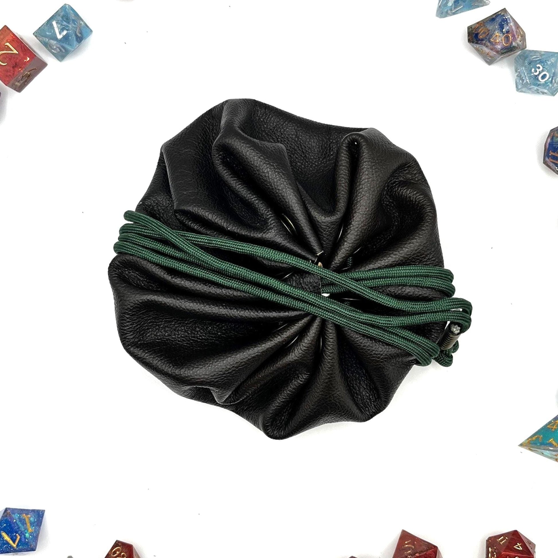 Handcrafted leather dice bag with drawstring, ideal for storing RPG dice sets. Perfect for DnD, tabletop games, or as a fantasy gift for gamers.
