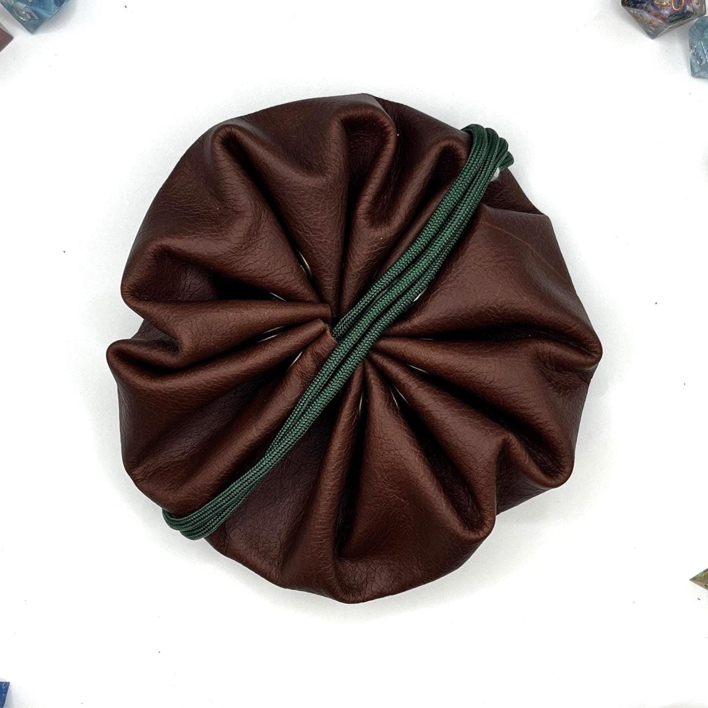 Handcrafted leather dice bag with drawstring, ideal for storing RPG dice sets. Perfect for DnD, tabletop games, or as a fantasy gift for gamers.
