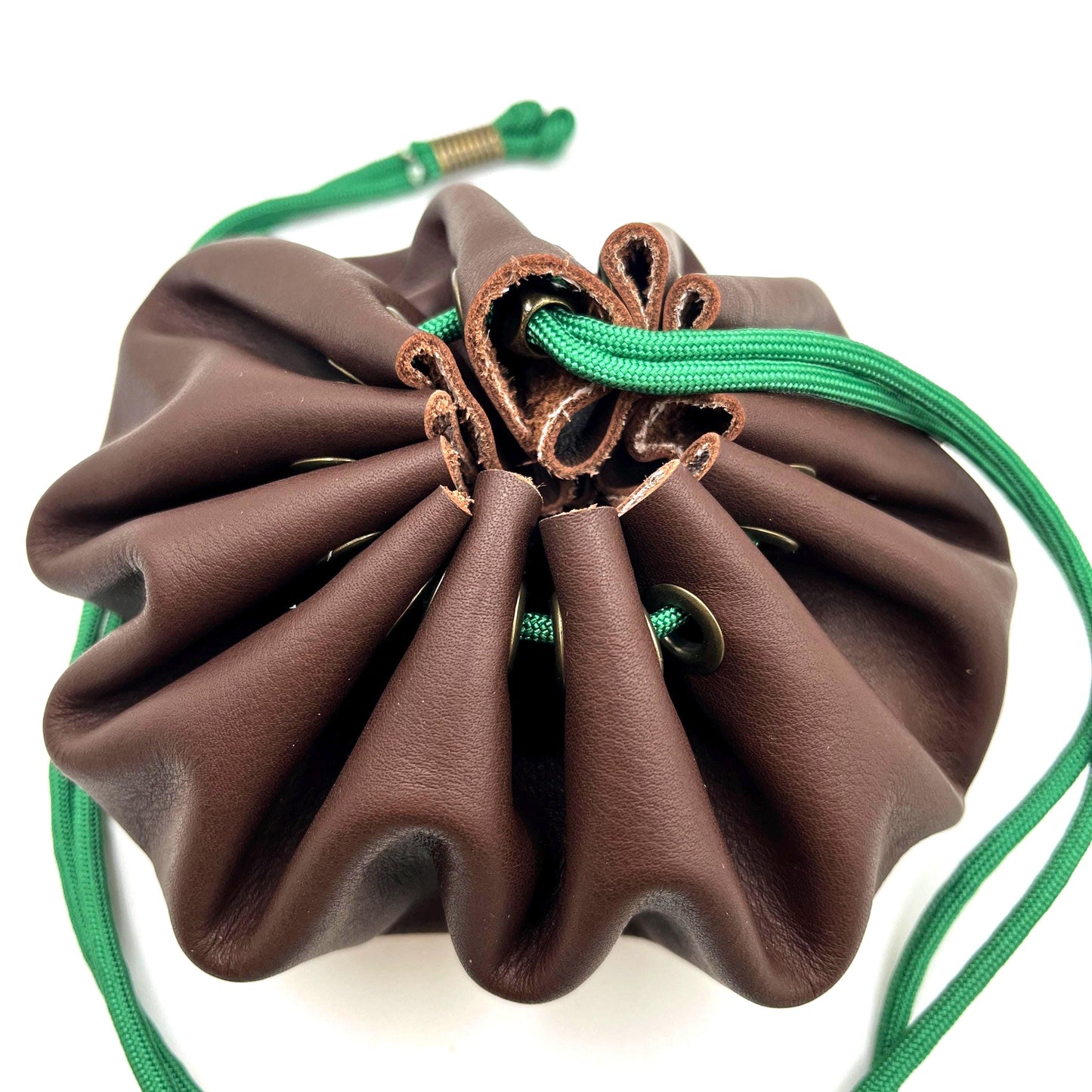Handcrafted leather dice bag with drawstring, ideal for storing RPG dice sets. Perfect for DnD, tabletop games, or as a fantasy gift for gamers.