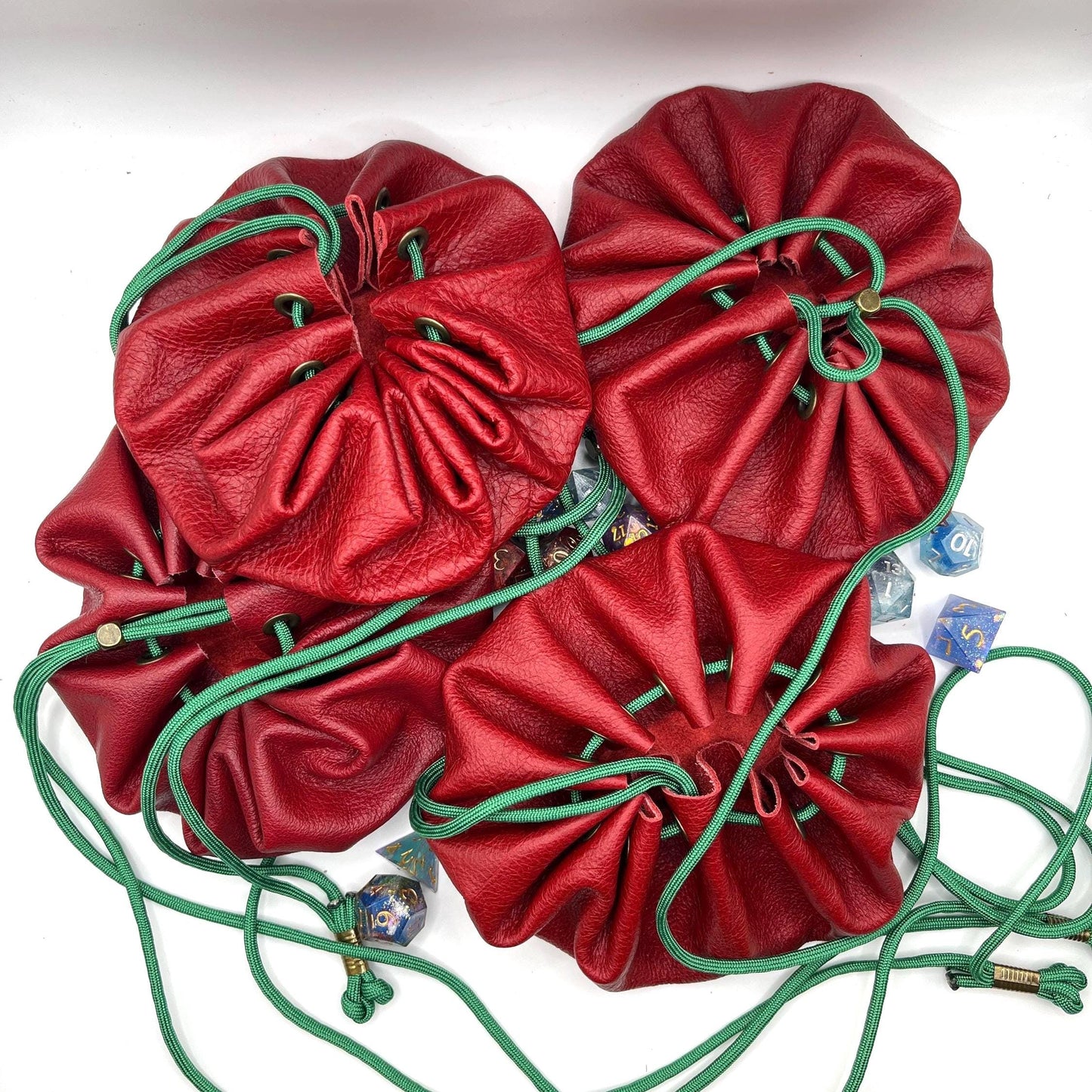 Handcrafted leather dice bag with drawstring, ideal for storing RPG dice sets. Perfect for DnD, tabletop games, or as a fantasy gift for gamers.