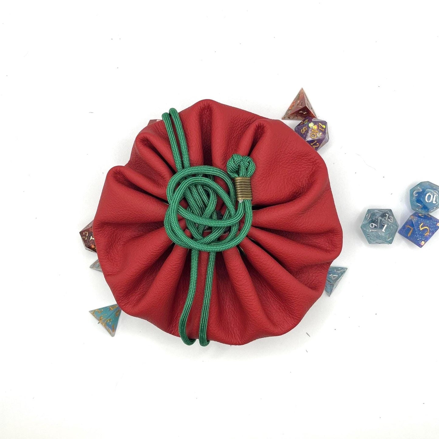 Handcrafted leather dice bag with drawstring, ideal for storing RPG dice sets. Perfect for DnD, tabletop games, or as a fantasy gift for gamers.