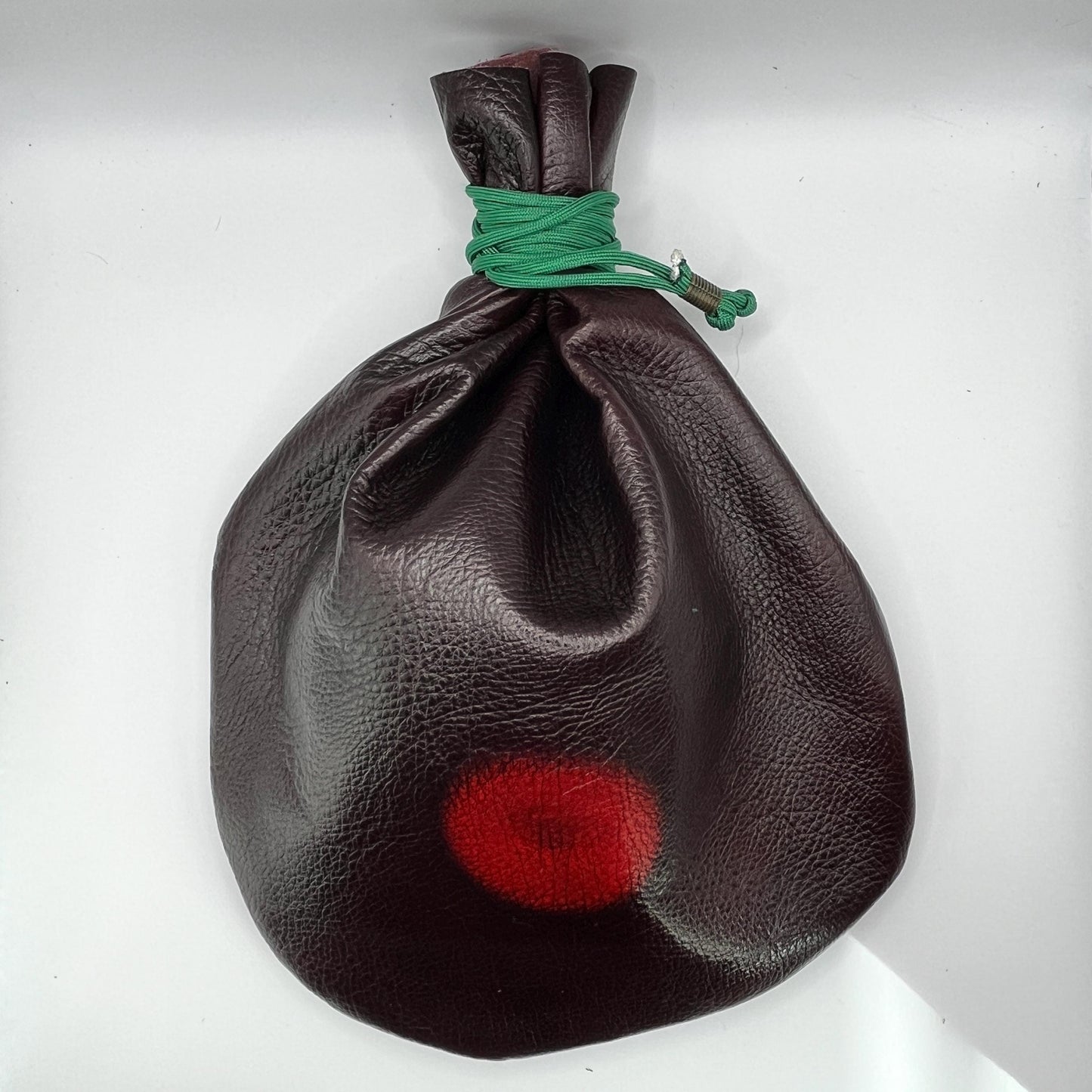 Handcrafted leather dice bag with drawstring, ideal for storing RPG dice sets. Perfect for DnD, tabletop games, or as a fantasy gift for gamers.