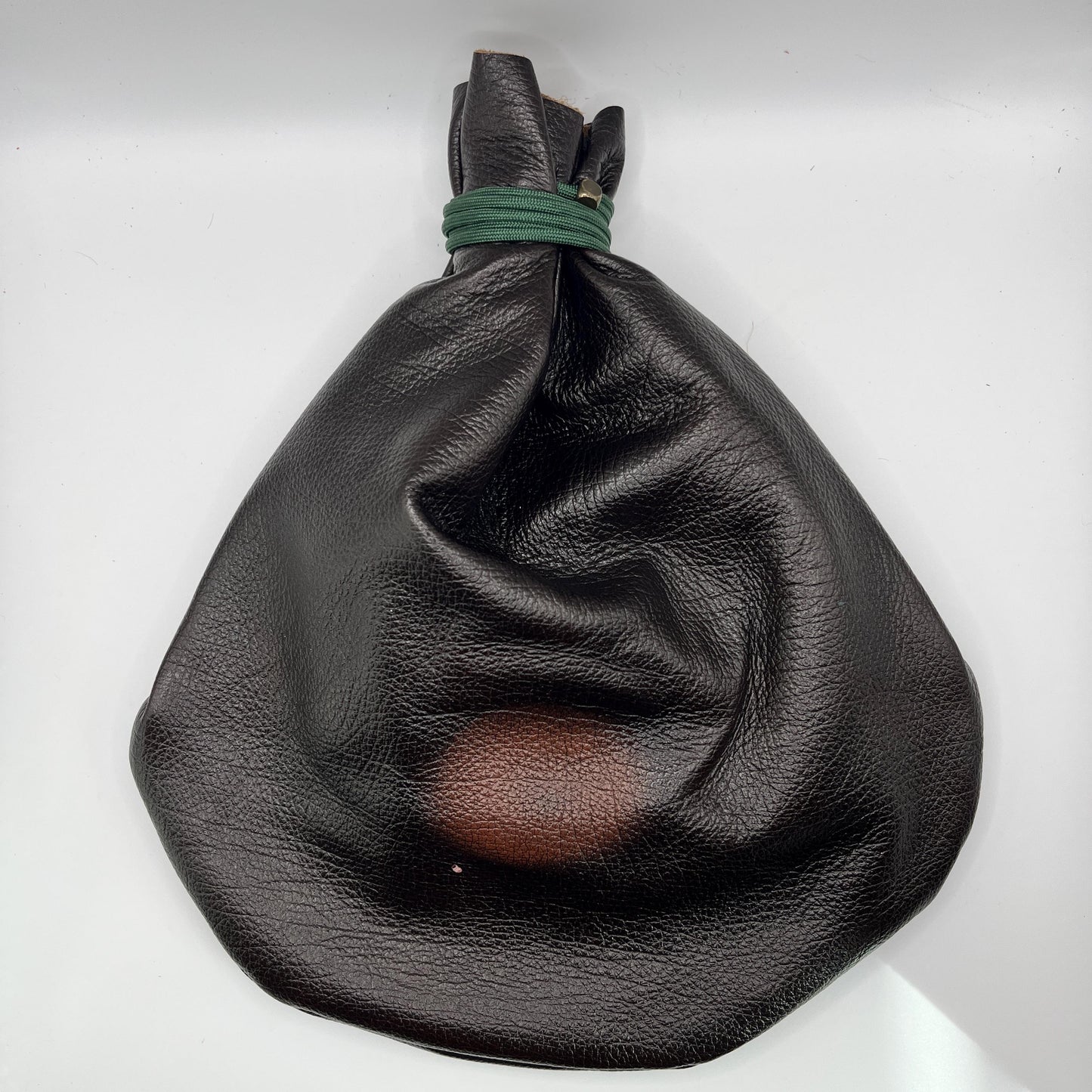 Handcrafted leather dice bag with drawstring, ideal for storing RPG dice sets. Perfect for DnD, tabletop games, or as a fantasy gift for gamers.