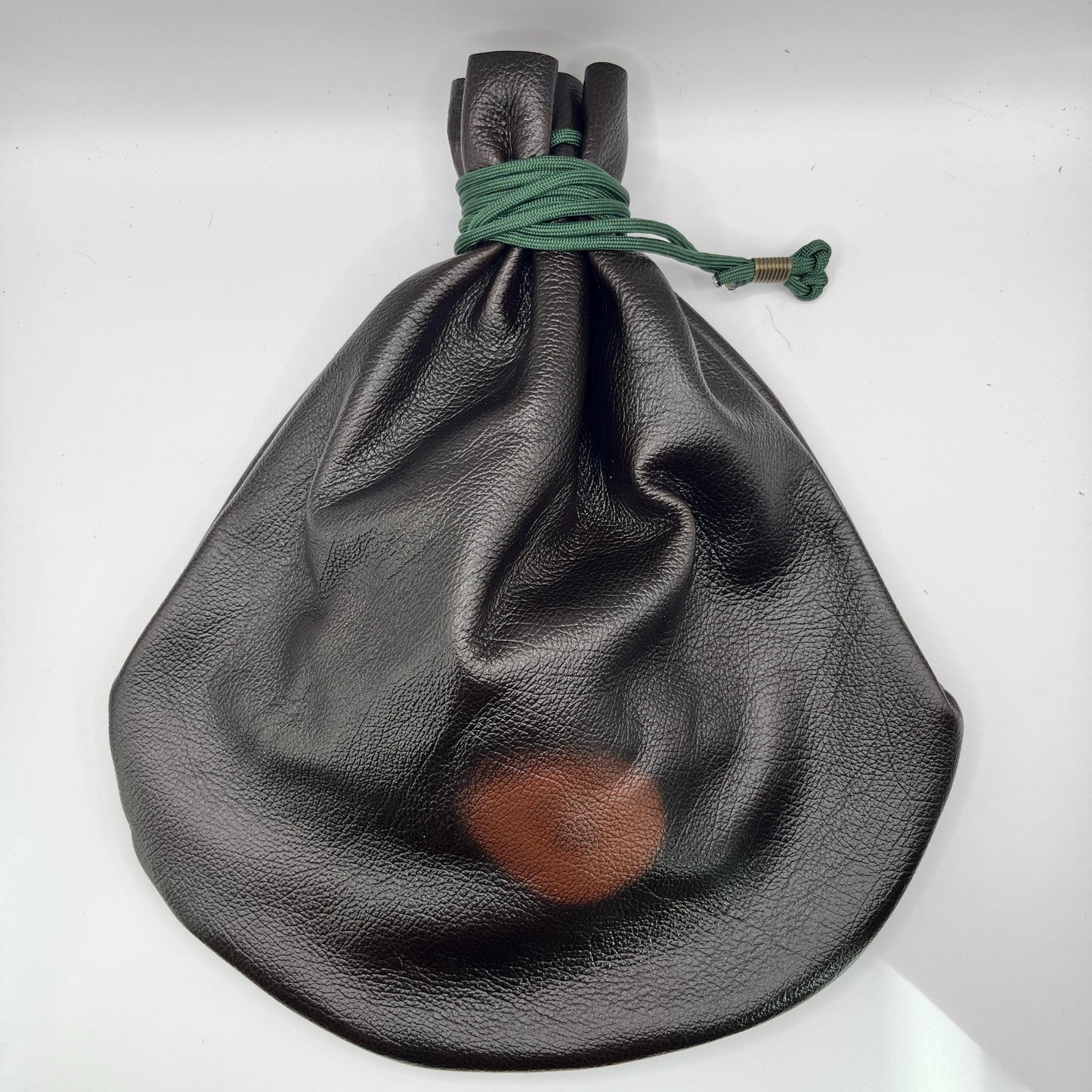 Handcrafted leather dice bag with drawstring, ideal for storing RPG dice sets. Perfect for DnD, tabletop games, or as a fantasy gift for gamers.