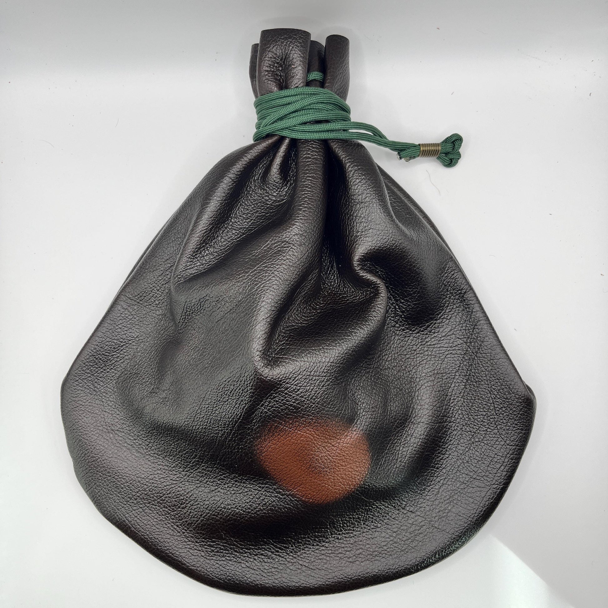 Handcrafted leather dice bag with drawstring, ideal for storing RPG dice sets. Perfect for DnD, tabletop games, or as a fantasy gift for gamers.