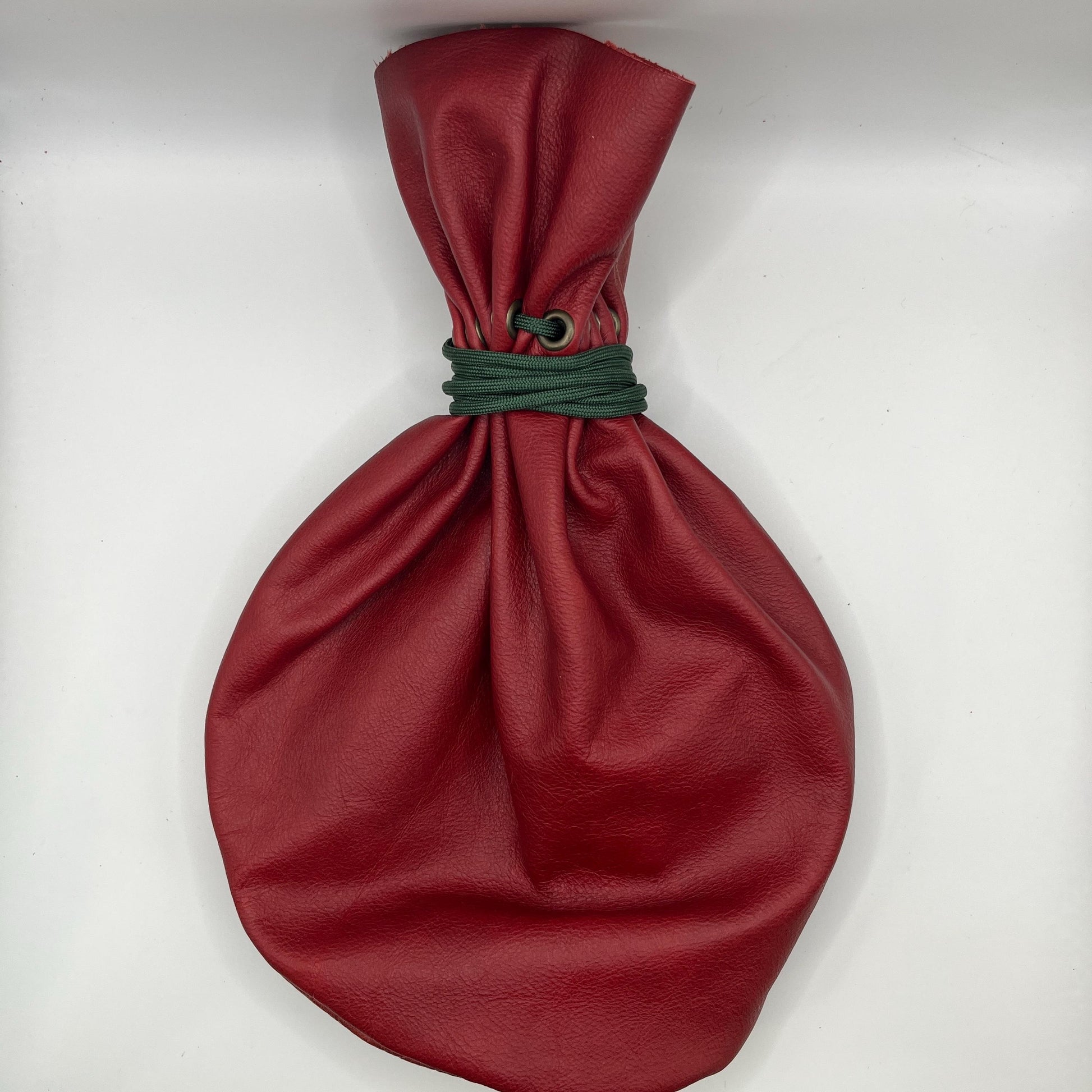 Handcrafted leather dice bag with drawstring, ideal for storing RPG dice sets. Perfect for DnD, tabletop games, or as a fantasy gift for gamers.