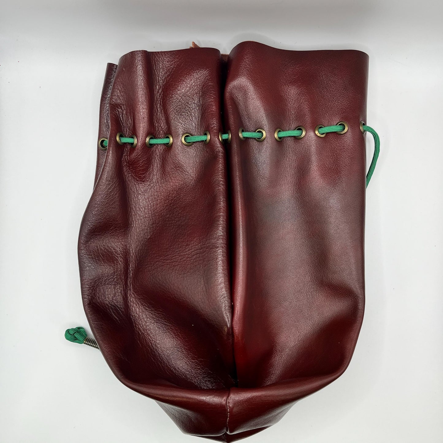 Handcrafted leather dice bag with drawstring, ideal for storing RPG dice sets. Perfect for DnD, tabletop games, or as a fantasy gift for gamers.
