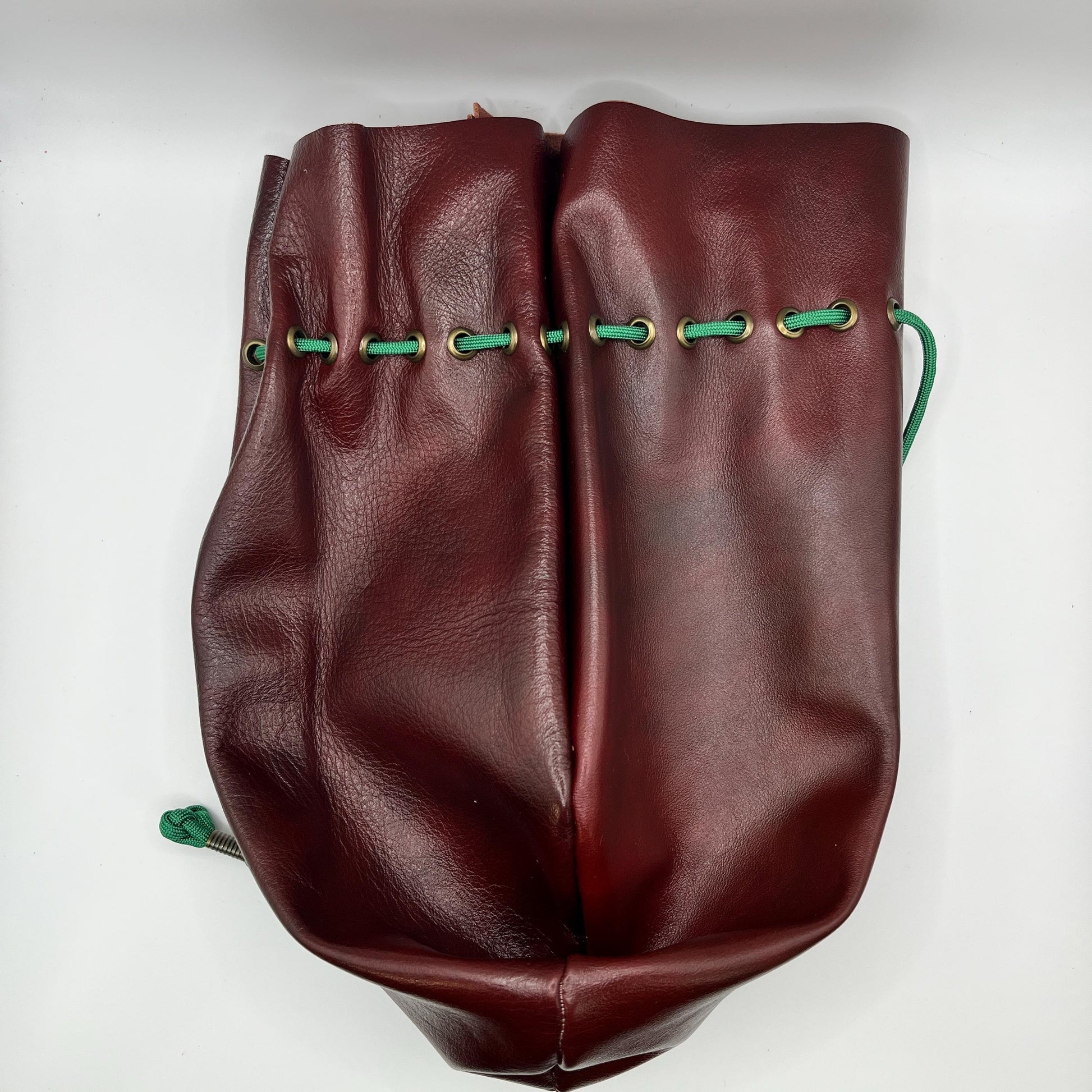 Handcrafted leather dice bag with drawstring, ideal for storing RPG dice sets. Perfect for DnD, tabletop games, or as a fantasy gift for gamers.