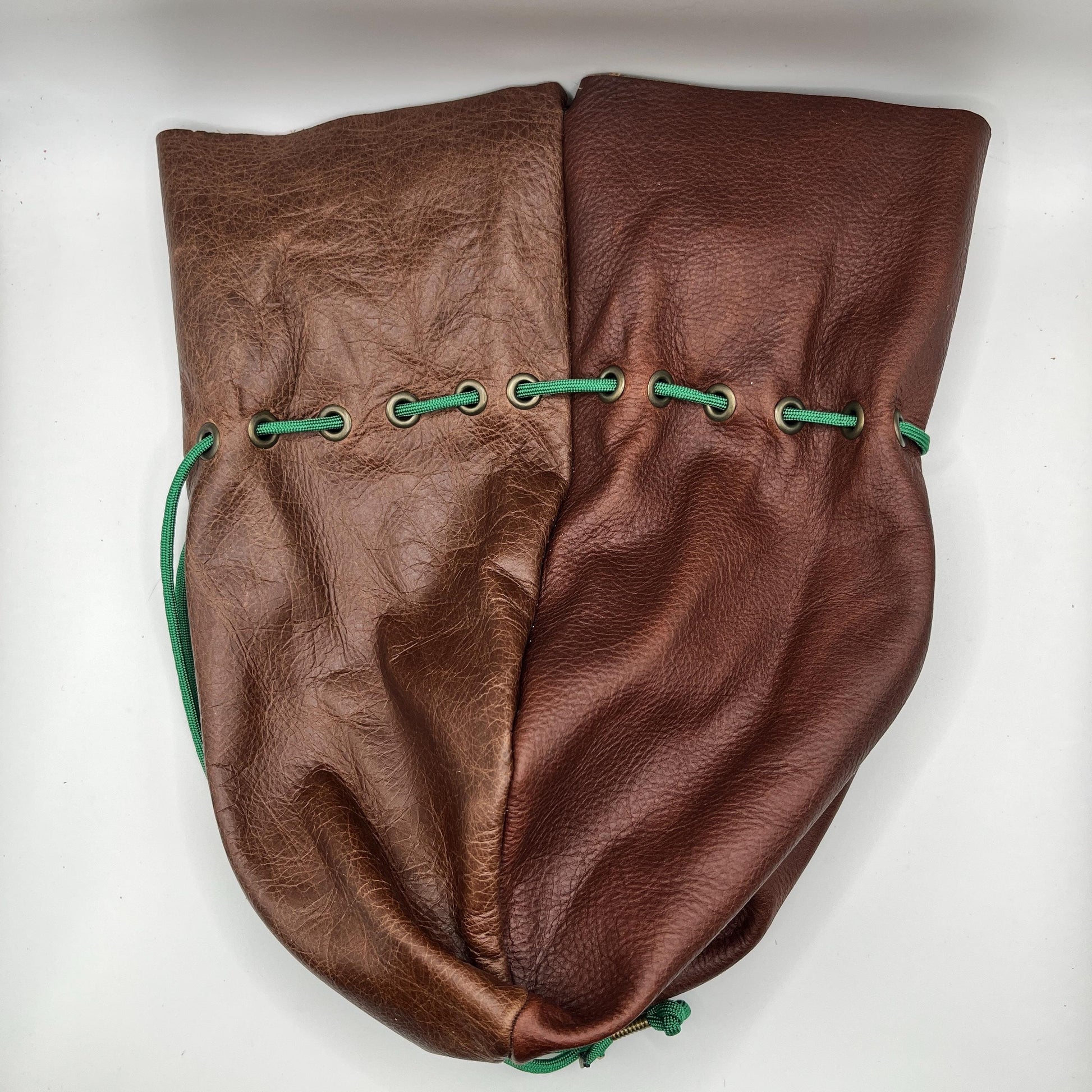 Handcrafted leather dice bag with drawstring, ideal for storing RPG dice sets. Perfect for DnD, tabletop games, or as a fantasy gift for gamers.
