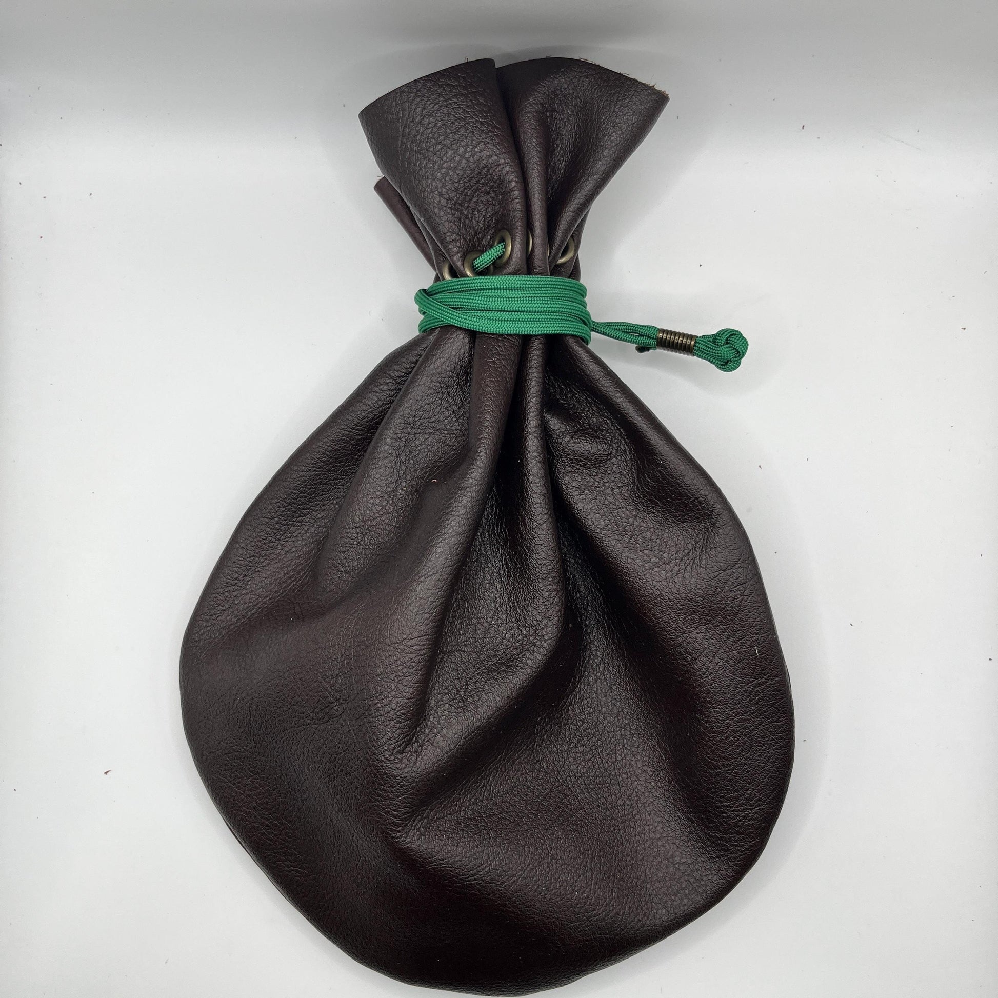 Handcrafted leather dice bag with drawstring, ideal for storing RPG dice sets. Perfect for DnD, tabletop games, or as a fantasy gift for gamers.