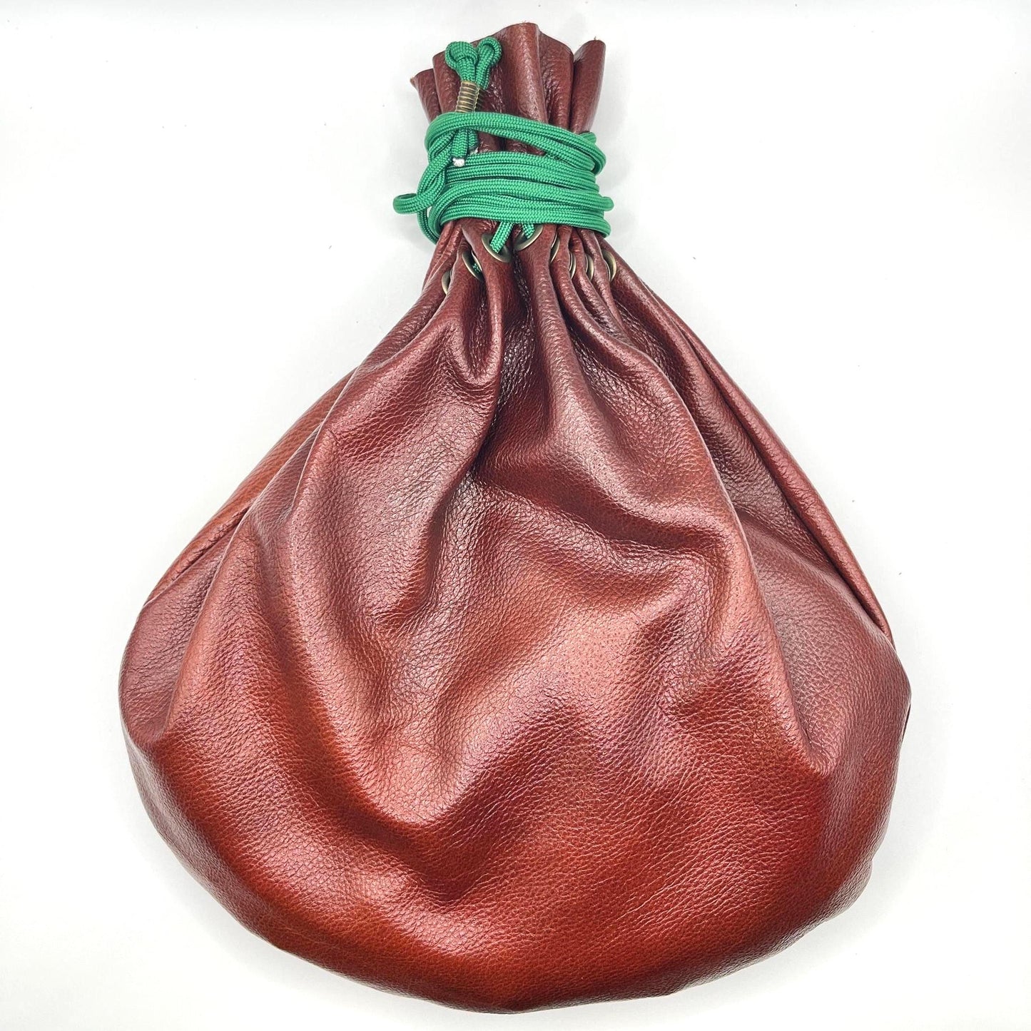 Handcrafted leather dice bag with drawstring, ideal for storing RPG dice sets. Perfect for DnD, tabletop games, or as a fantasy gift for gamers.