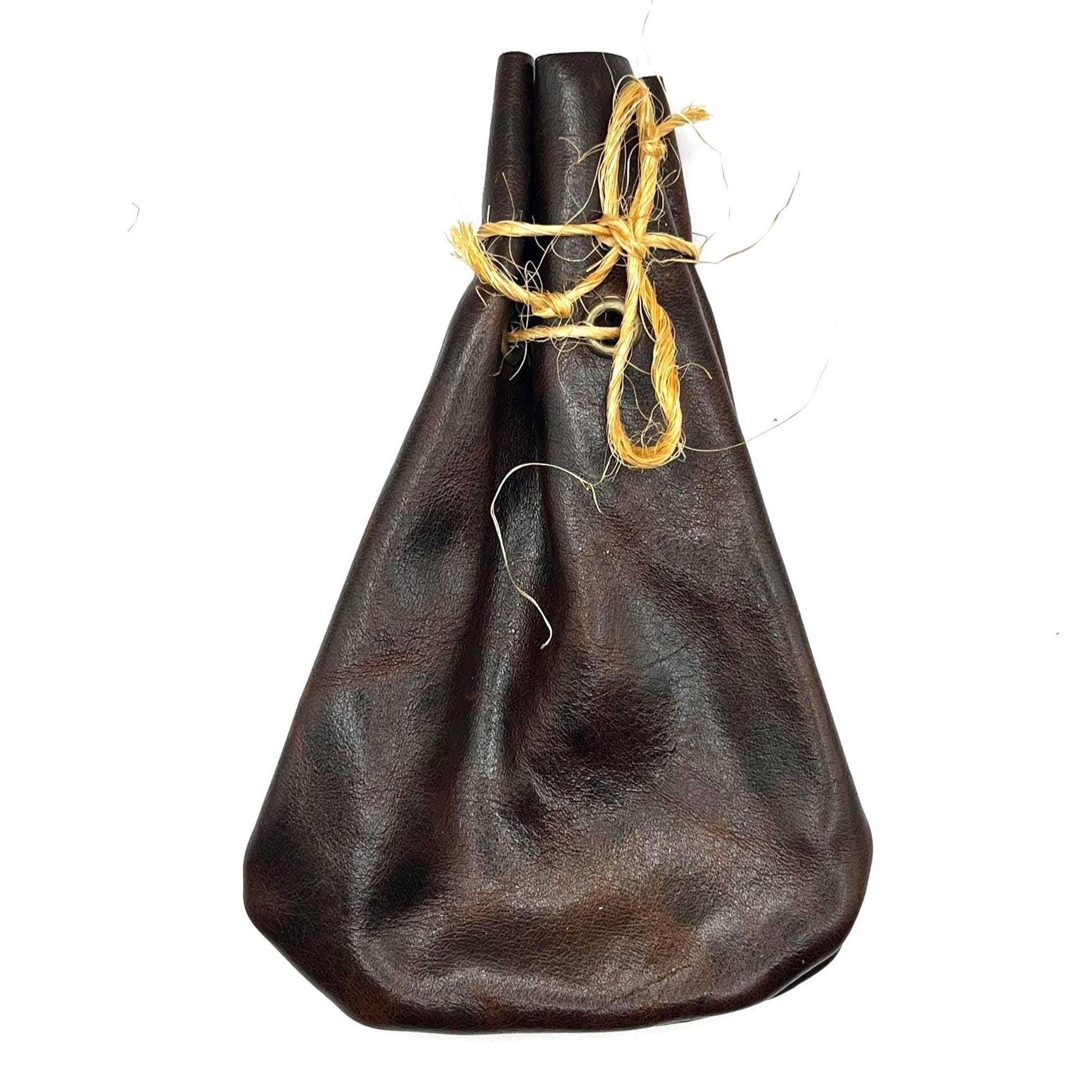 Handcrafted leather dice bag with drawstring, ideal for storing RPG dice sets. Perfect for DnD, tabletop games, or as a fantasy gift for gamers.