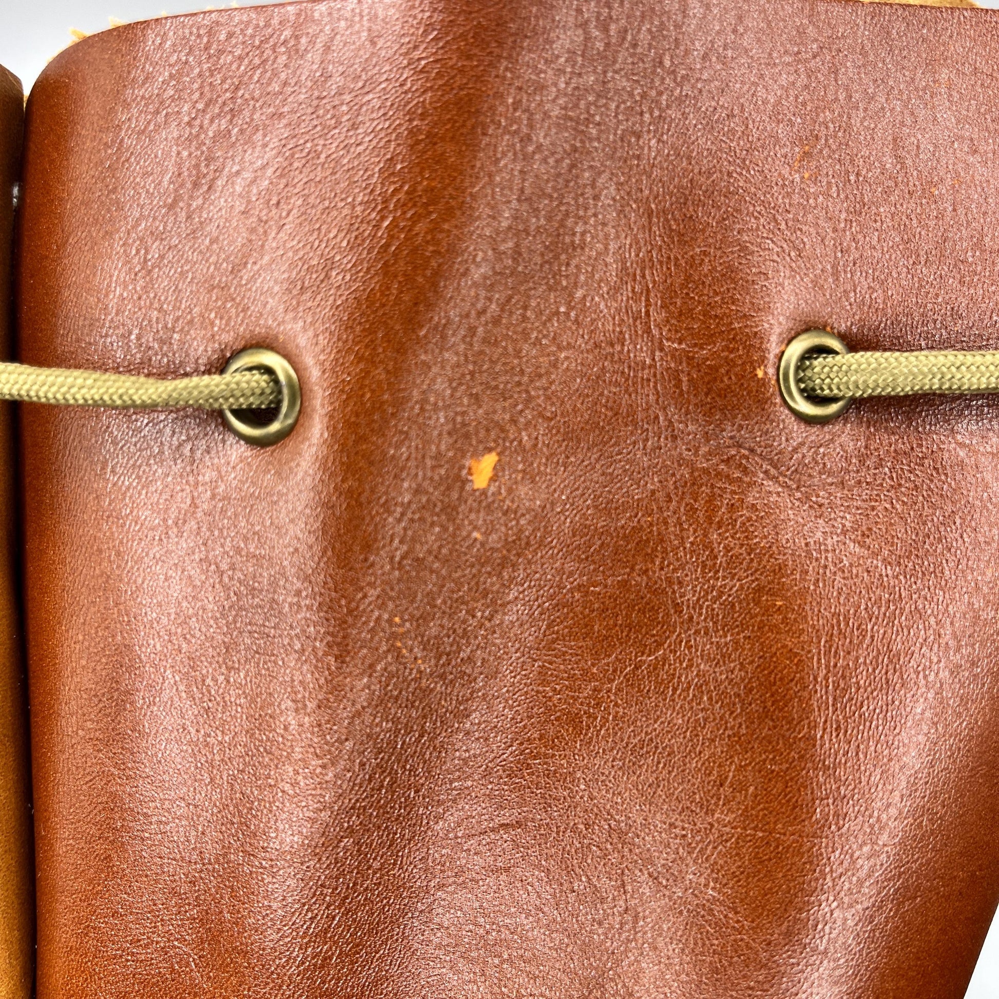 Handcrafted leather dice bag with drawstring, ideal for storing RPG dice sets. Perfect for DnD, tabletop games, or as a fantasy gift for gamers.
