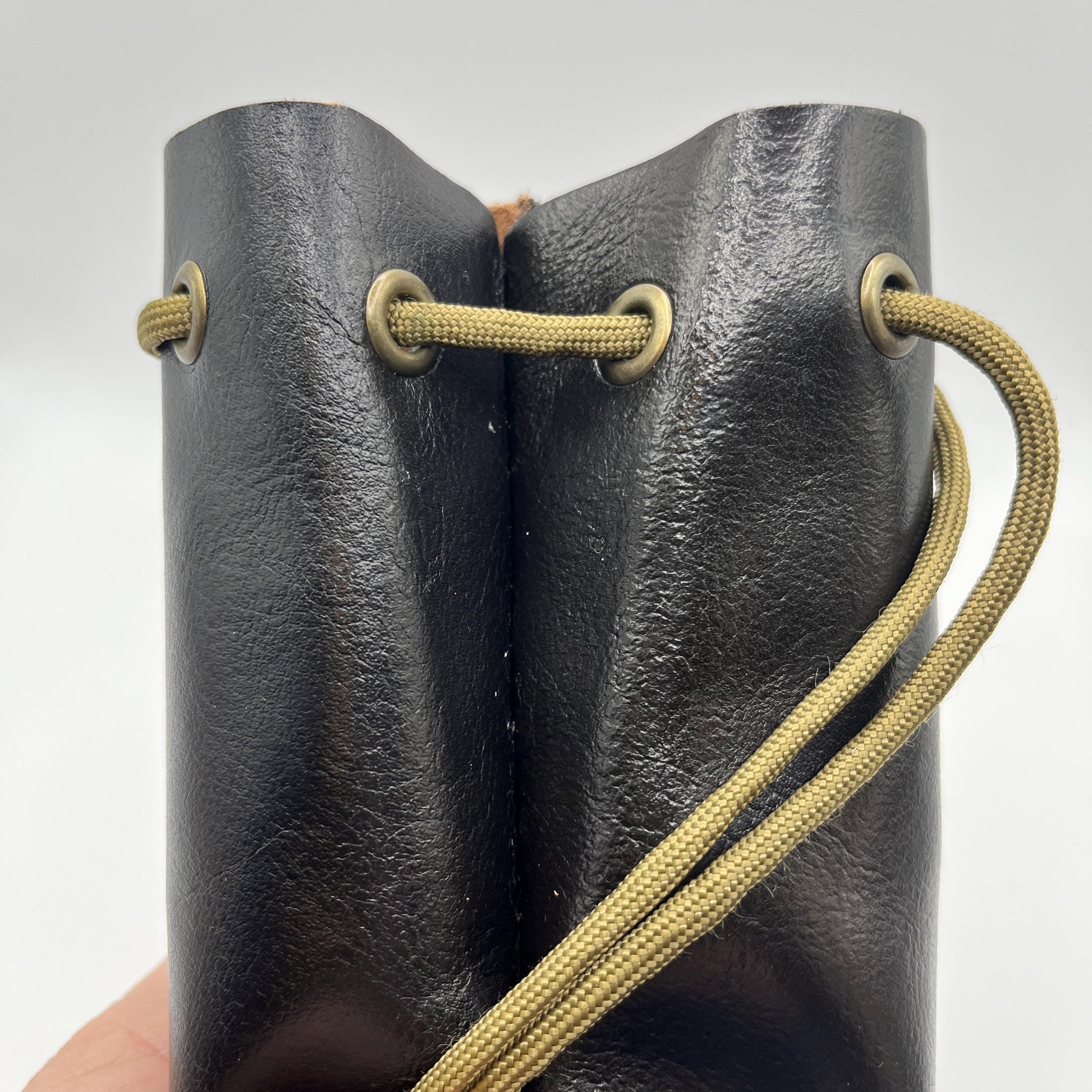 Handcrafted leather dice bag with drawstring, ideal for storing RPG dice sets. Perfect for DnD, tabletop games, or as a fantasy gift for gamers.