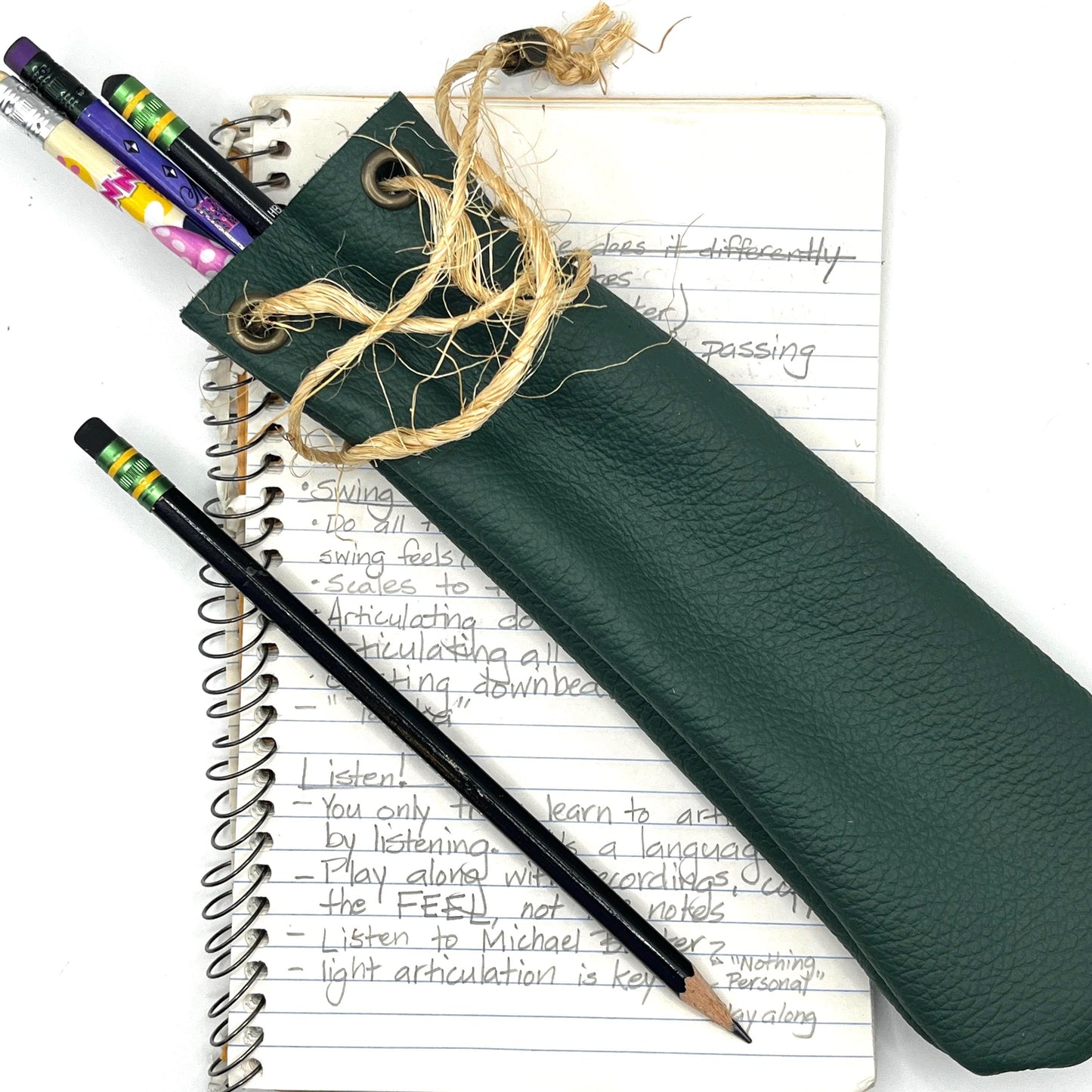 Handmade upcycled Italian leather pencil bag with drawstring, minimalist brown leather pen pouch for school, office, or travel, sustainable artisan stationery case.