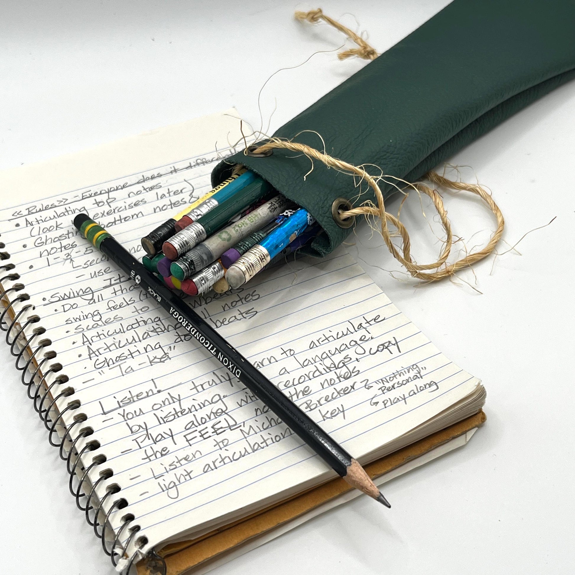 Handmade upcycled Italian leather pencil bag with drawstring, minimalist brown leather pen pouch for school, office, or travel, sustainable artisan stationery case.