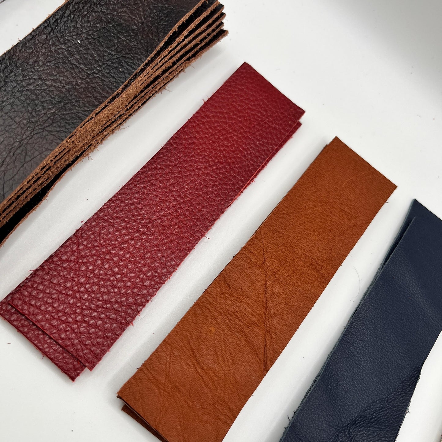 Handmade upcycled Italian leather bookmark cut from upholstery-grade leather scraps, slim durable page marker with natural grain, sustainable gift for readers and book lovers