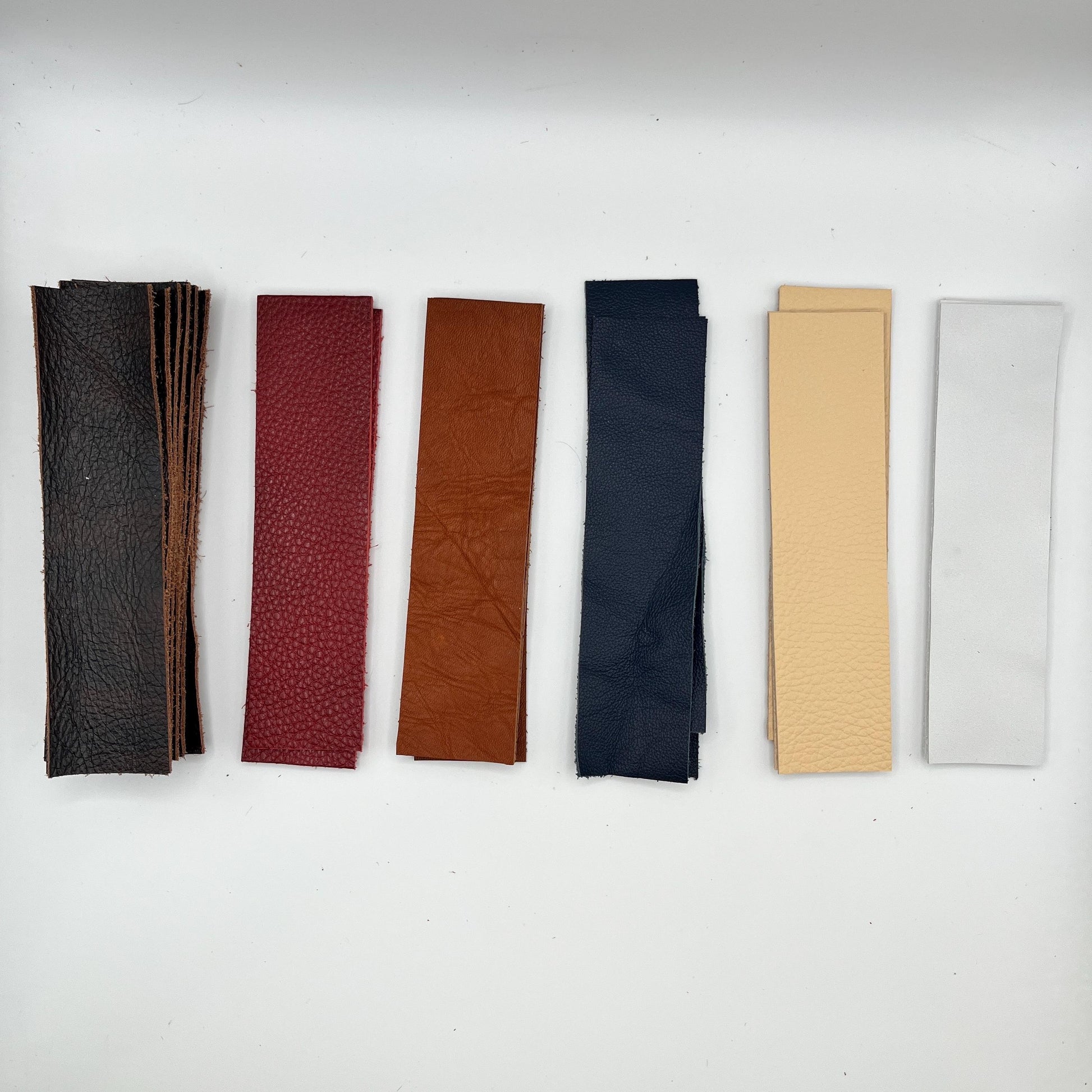 Handmade upcycled Italian leather bookmark cut from upholstery-grade leather scraps, slim durable page marker with natural grain, sustainable gift for readers and book lovers