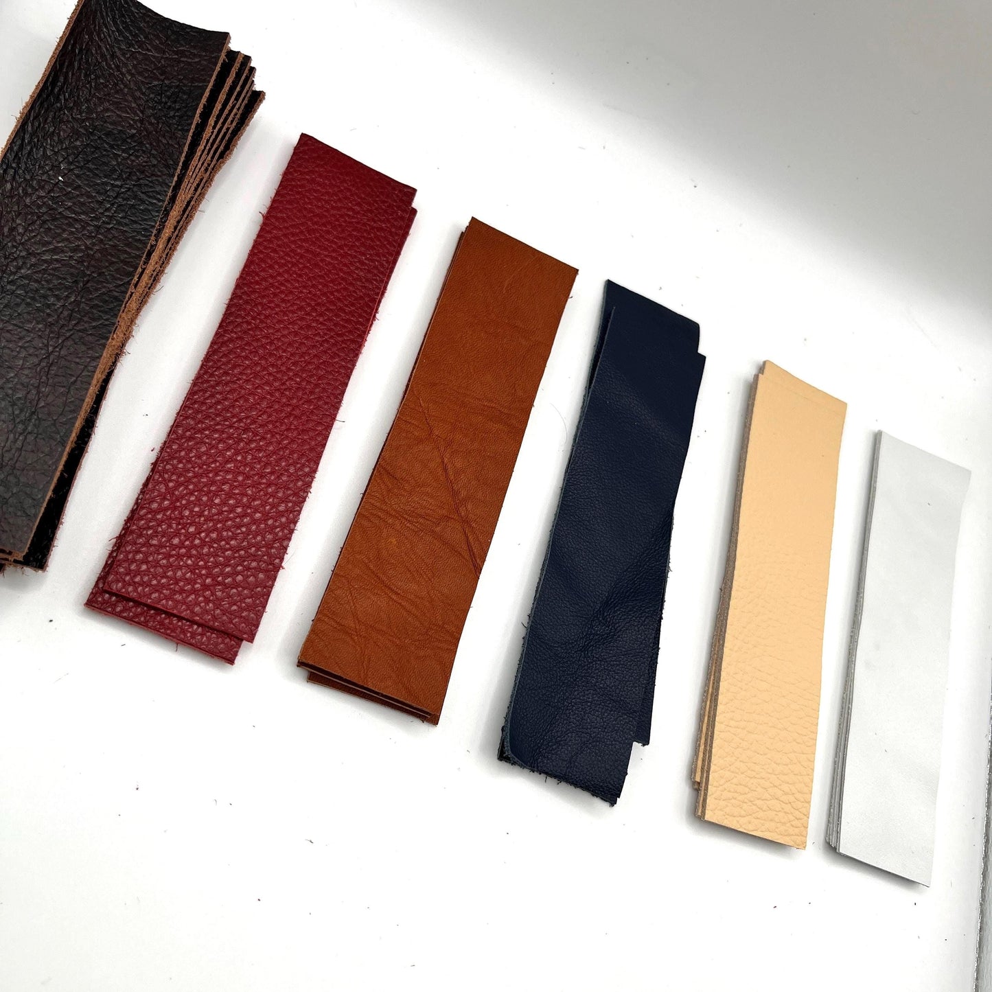Handmade upcycled Italian leather bookmark cut from upholstery-grade leather scraps, slim durable page marker with natural grain, sustainable gift for readers and book lovers