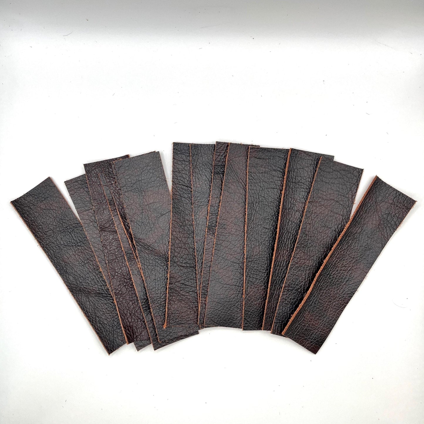 Handmade upcycled Italian leather bookmark cut from upholstery-grade leather scraps, slim durable page marker with natural grain, sustainable gift for readers and book lovers