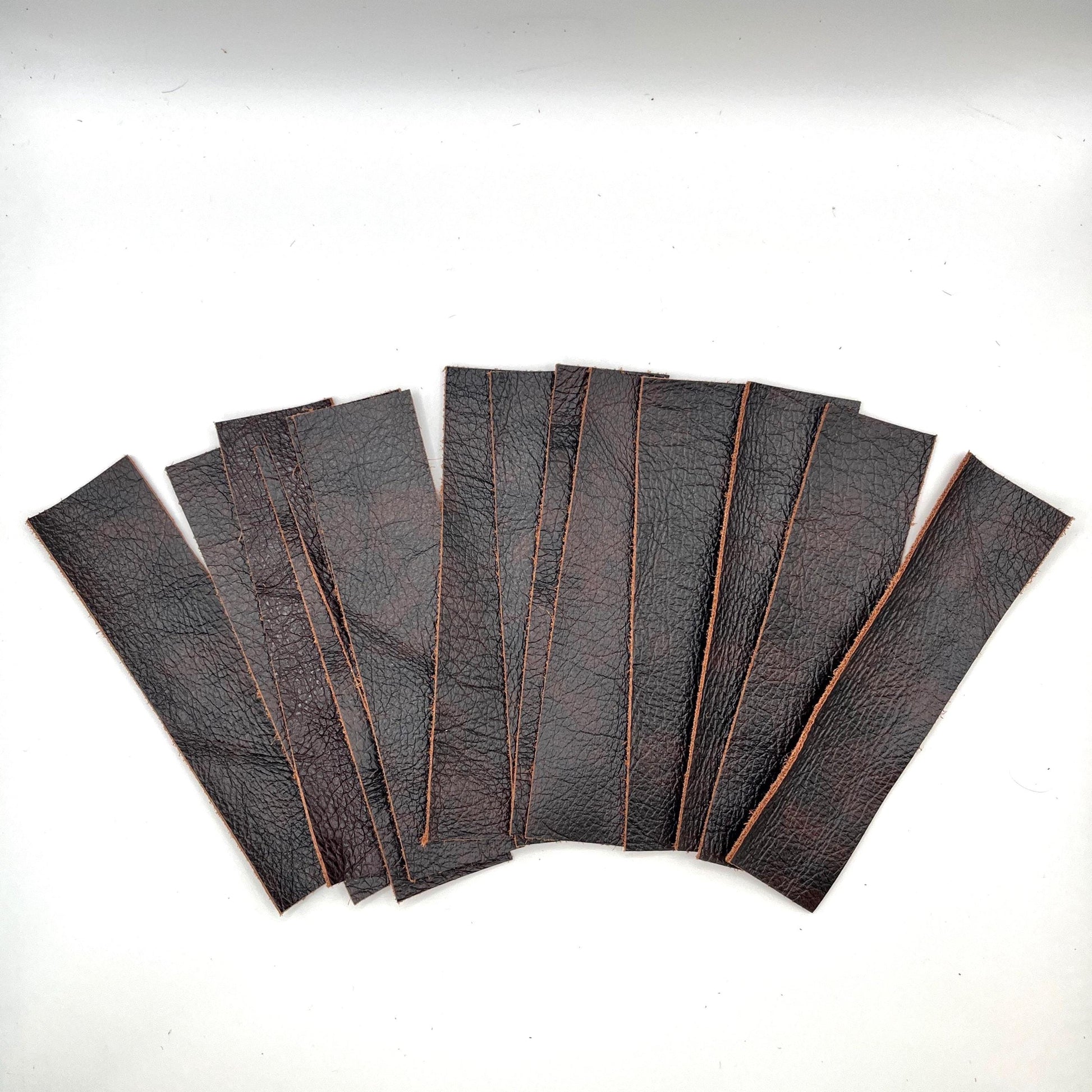 Handmade upcycled Italian leather bookmark cut from upholstery-grade leather scraps, slim durable page marker with natural grain, sustainable gift for readers and book lovers