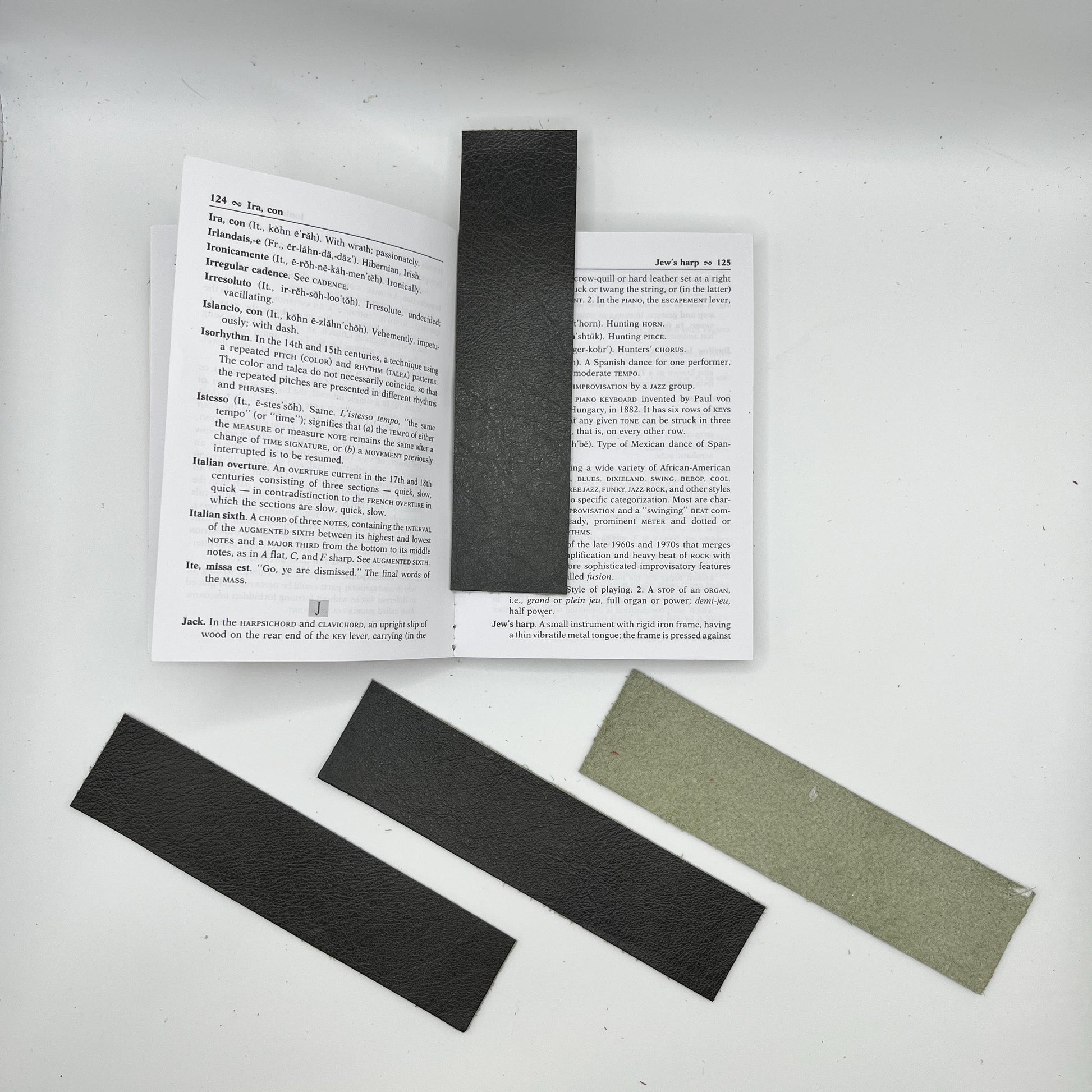 Handmade upcycled Italian green leather bookmark cut from upholstery-grade leather scraps, slim durable page marker with natural grain, sustainable gift for readers and book lovers