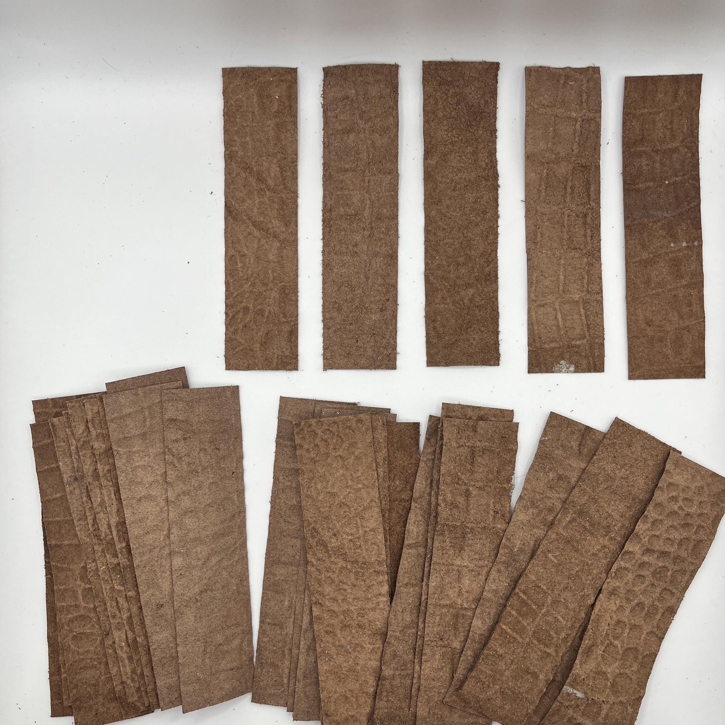 Handmade upcycled Italian leather bookmark cut from upholstery-grade leather scraps, slim durable page marker with natural grain, sustainable gift for readers and book lovers