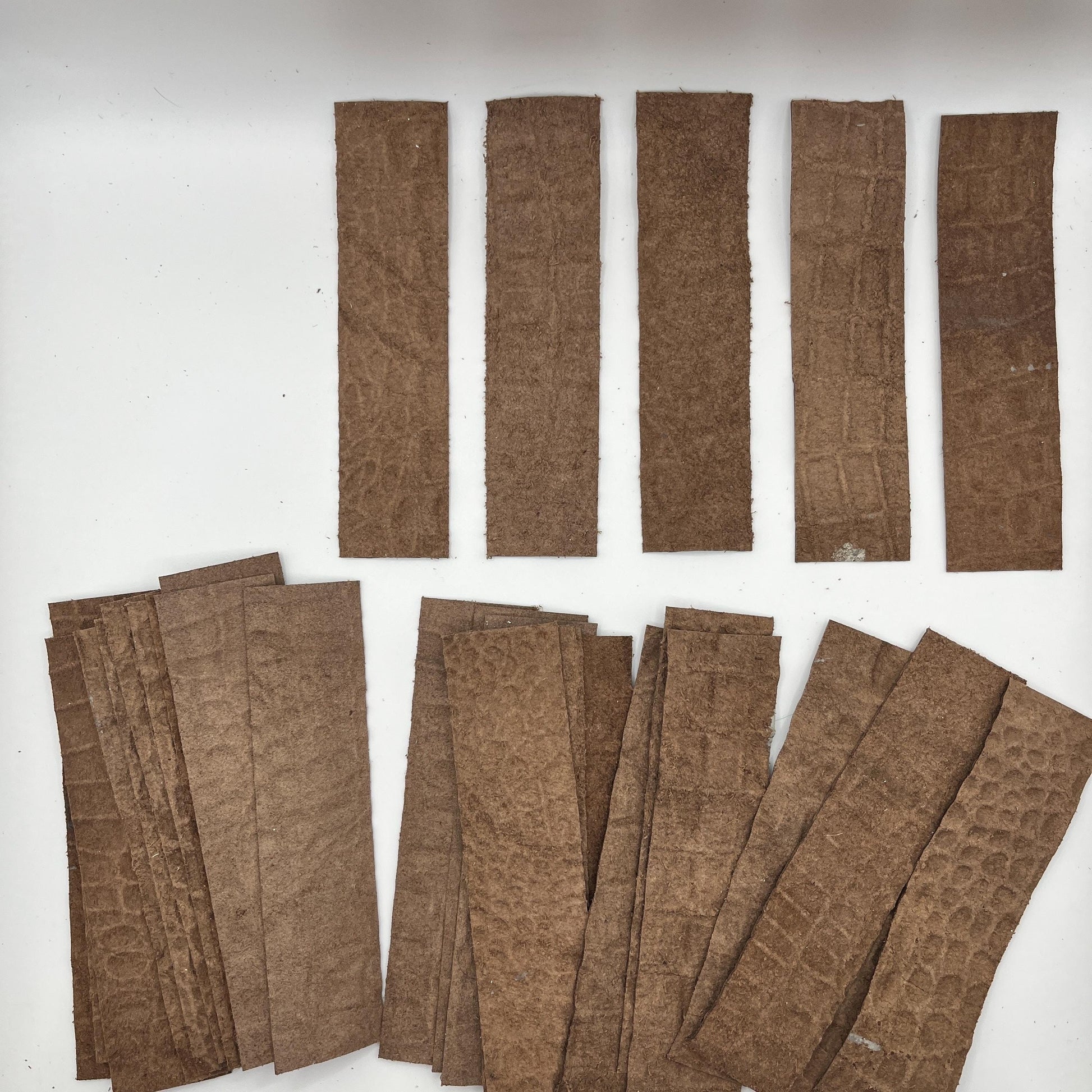 Handmade upcycled Italian leather bookmark cut from upholstery-grade leather scraps, slim durable page marker with natural grain, sustainable gift for readers and book lovers