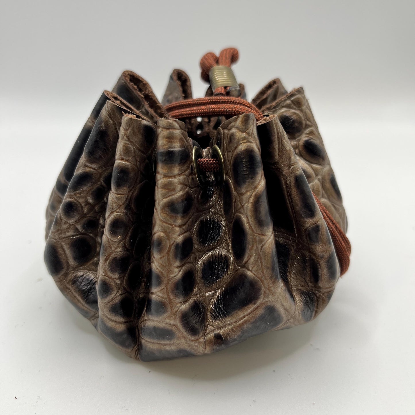 Handcrafted leather dice bag with drawstring, ideal for storing RPG dice sets. Perfect for DnD, tabletop games, or as a fantasy gift for gamers.